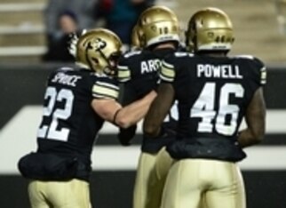 RB Christian Powell celebrates with teammates.