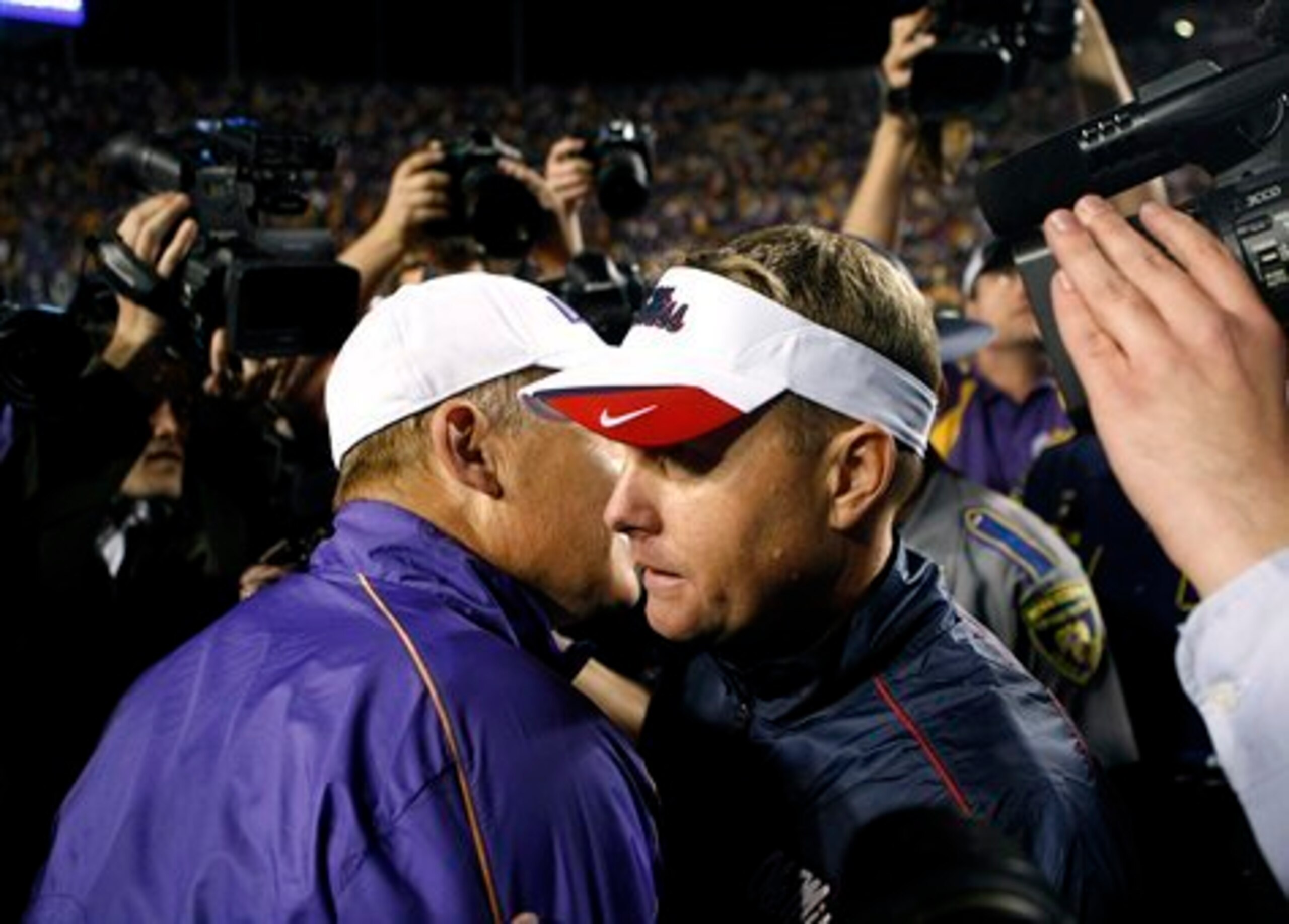 LSU head coach Les Miles and Ole Miss head coach Hugh Freeze