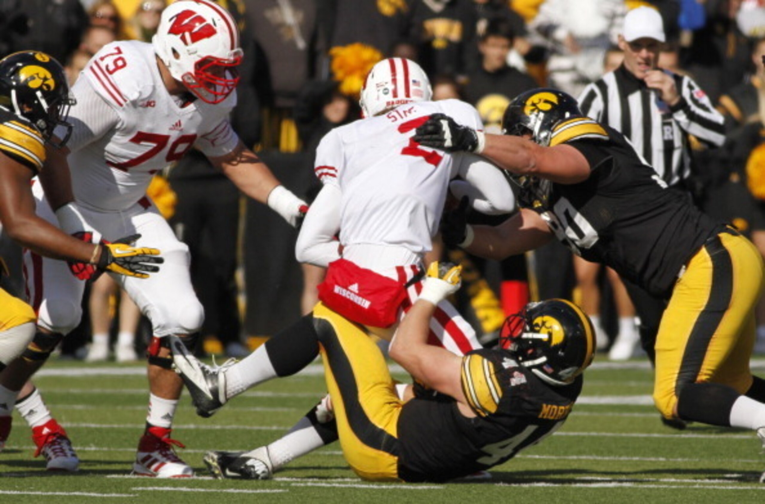 Will it be Joel Stave or Tanner McEvoy who leads the offense out on the field against LSU?