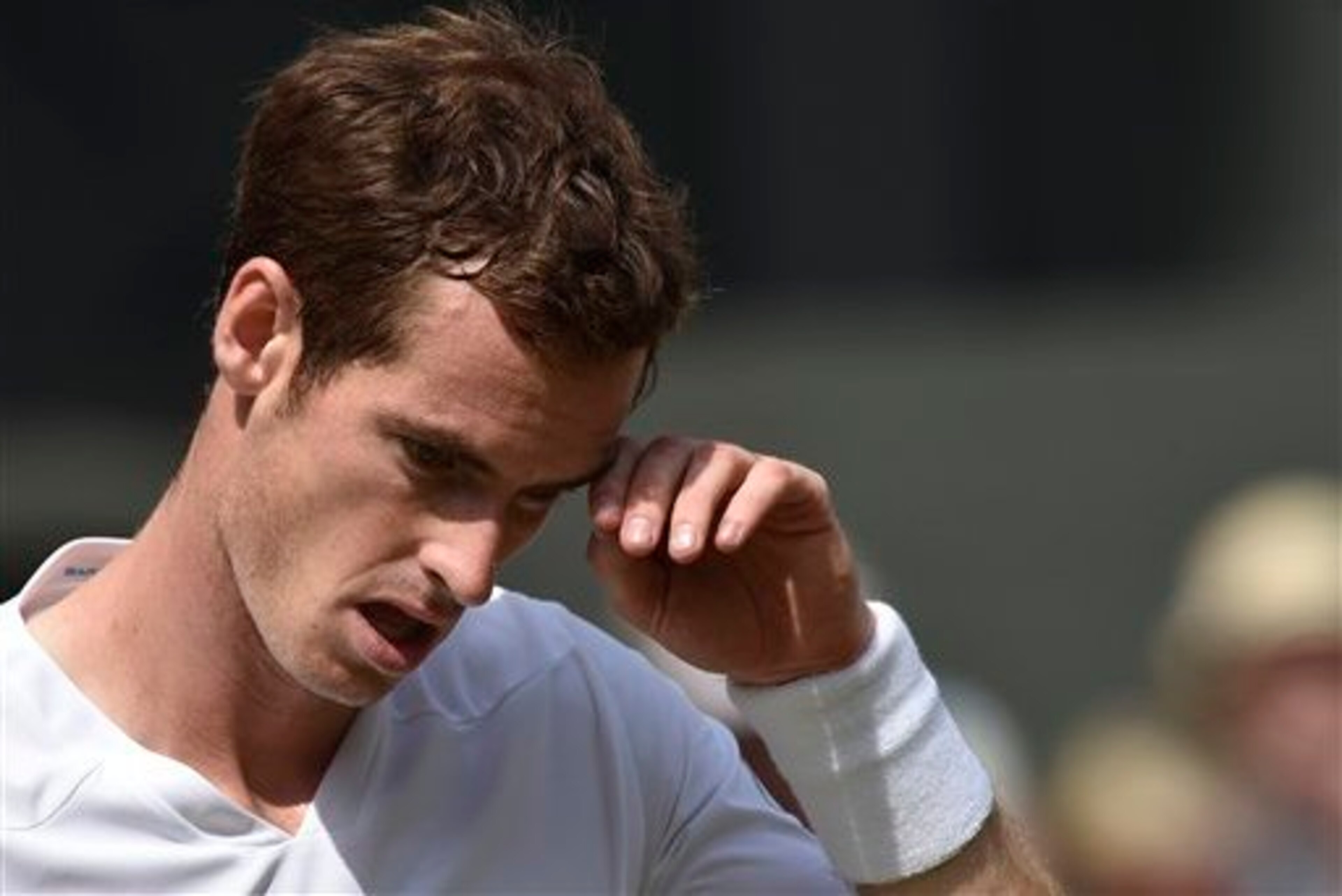 Andy Murray during his quarterfinals match at 2014 Wimbledon. Andy Murray during his quarterfinals match at 2014 Wimbledon.