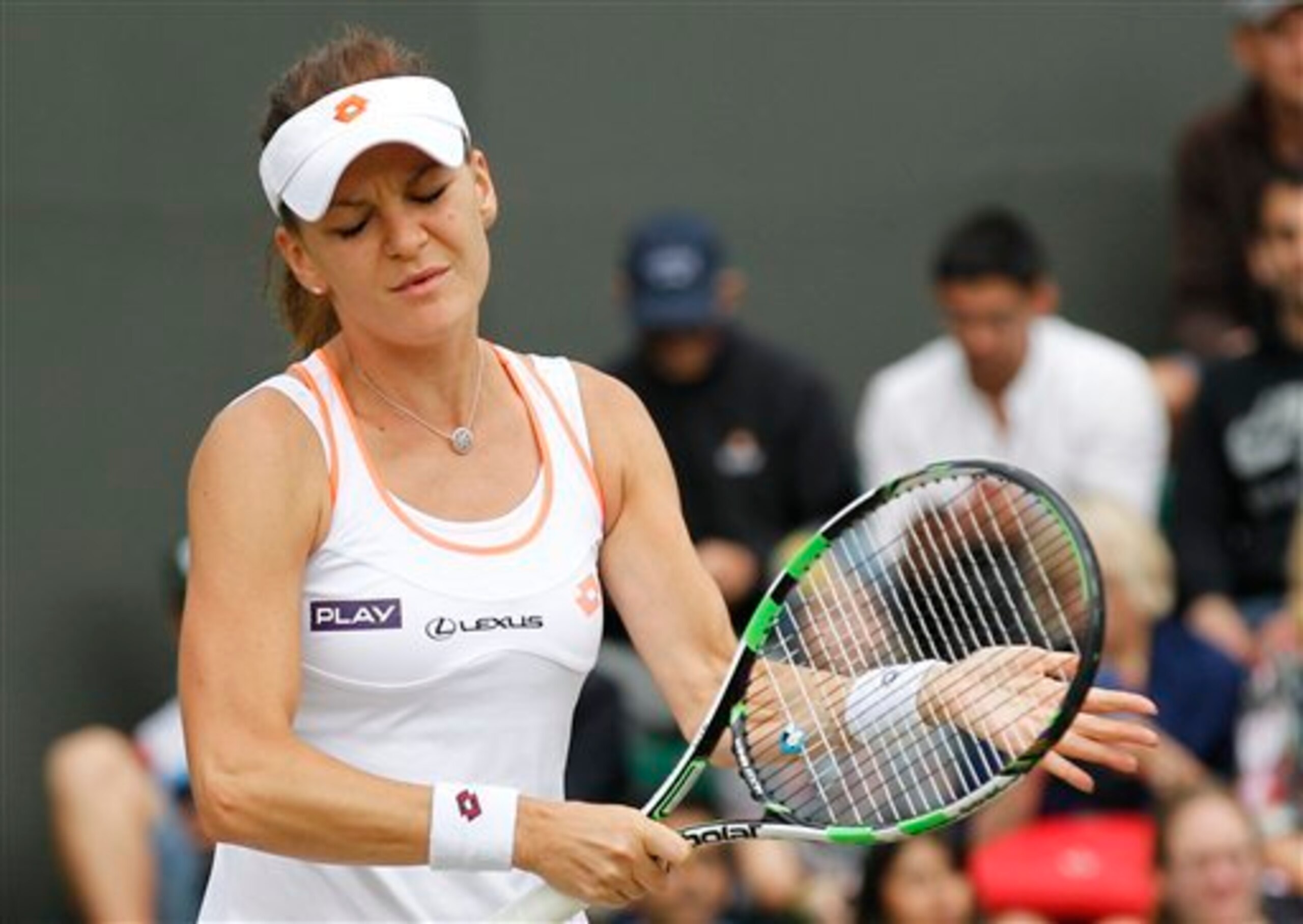 Agnieszka Radwanska shows frustration during a loss at 2014 Wimbledon.