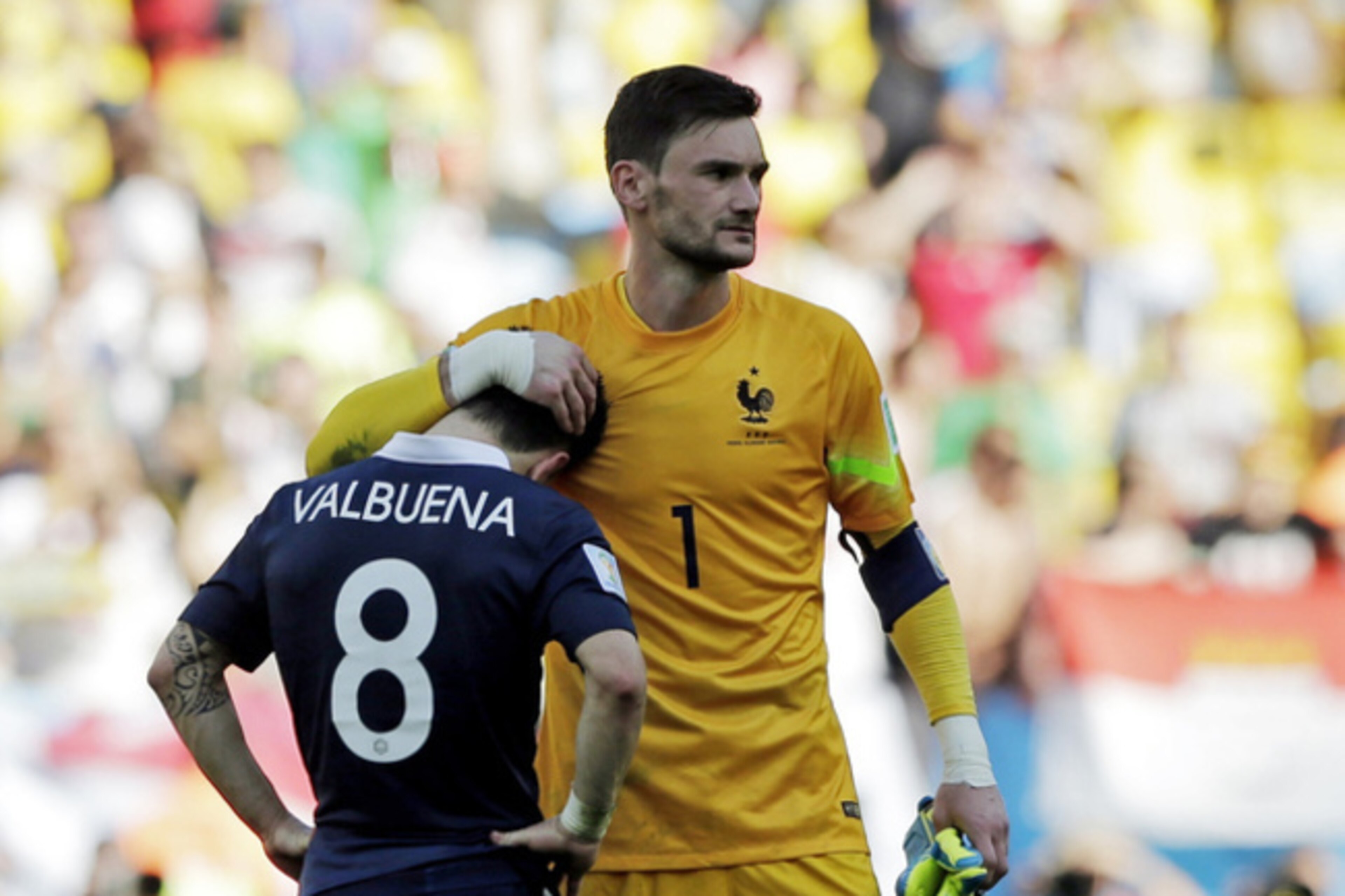 France captain Hugo Lloris consoles Mathieu Valbuena after their World Cup exit. Could he be a good Spurs skipper too?