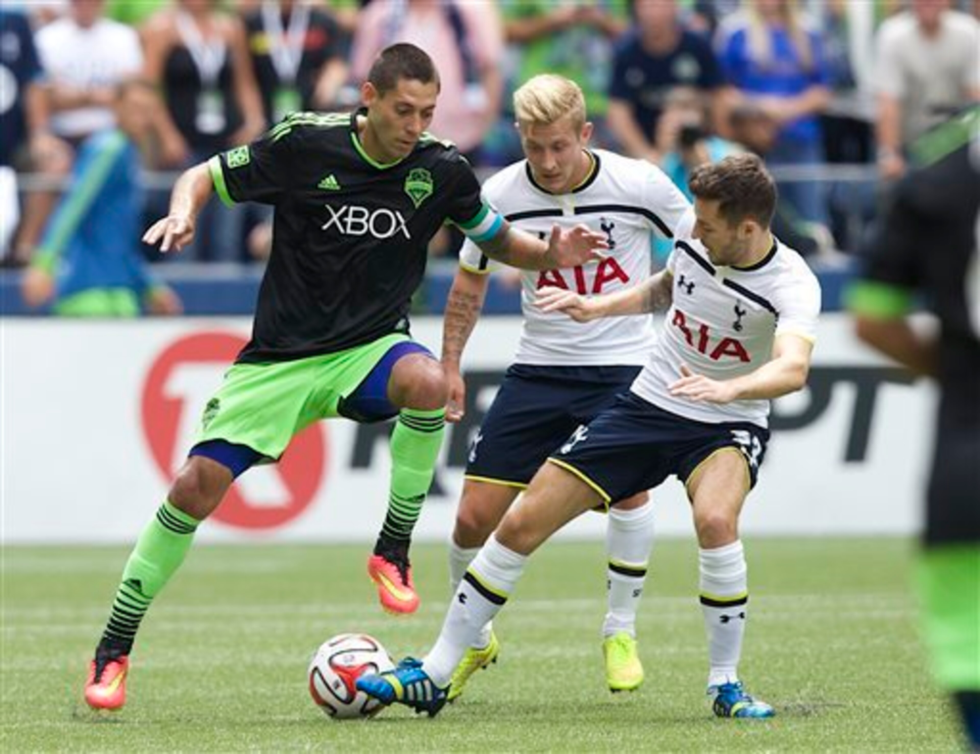 Lewis Holtby and Ryan Mason challenge their former Tottenham team-mate Clint Dempsey. Lewis Holtby and Ryan Mason challenge their former Tottenham team-mate Clint Dempsey.