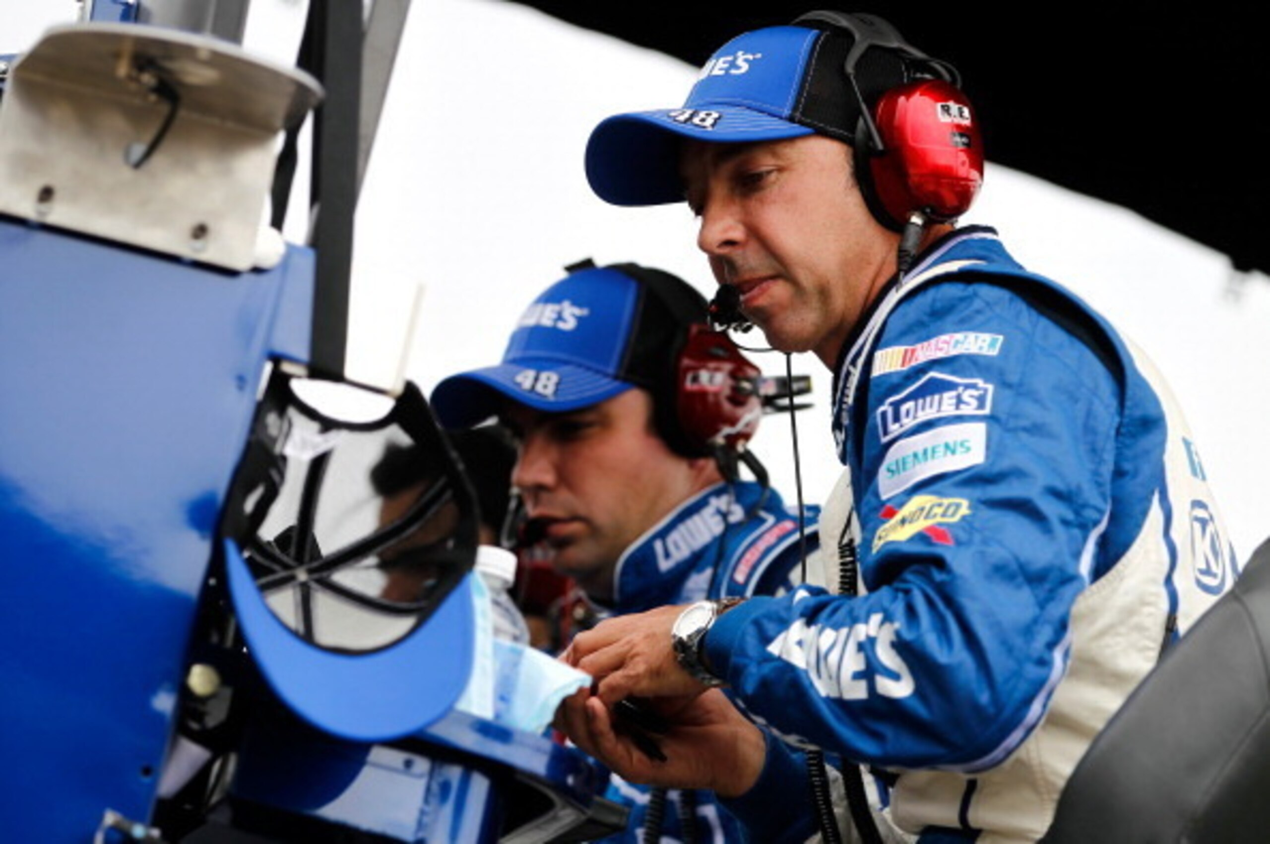 Jimmie Johnson's crew chief Chad Knaus (right) during GoBowling.com 400.