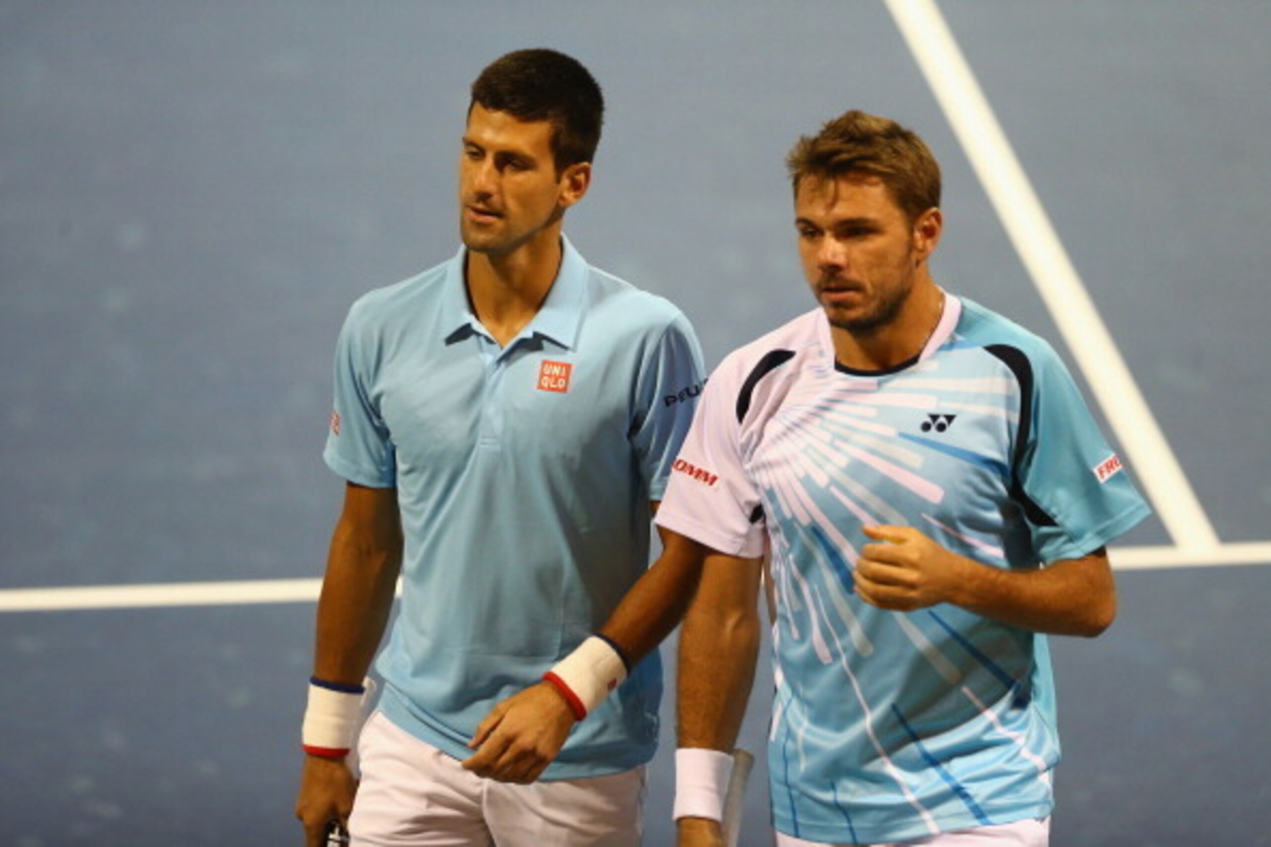 Novak Djokovic and Stan Wawrinka during their first-round doubles match at the 2014 Rogers Cup.