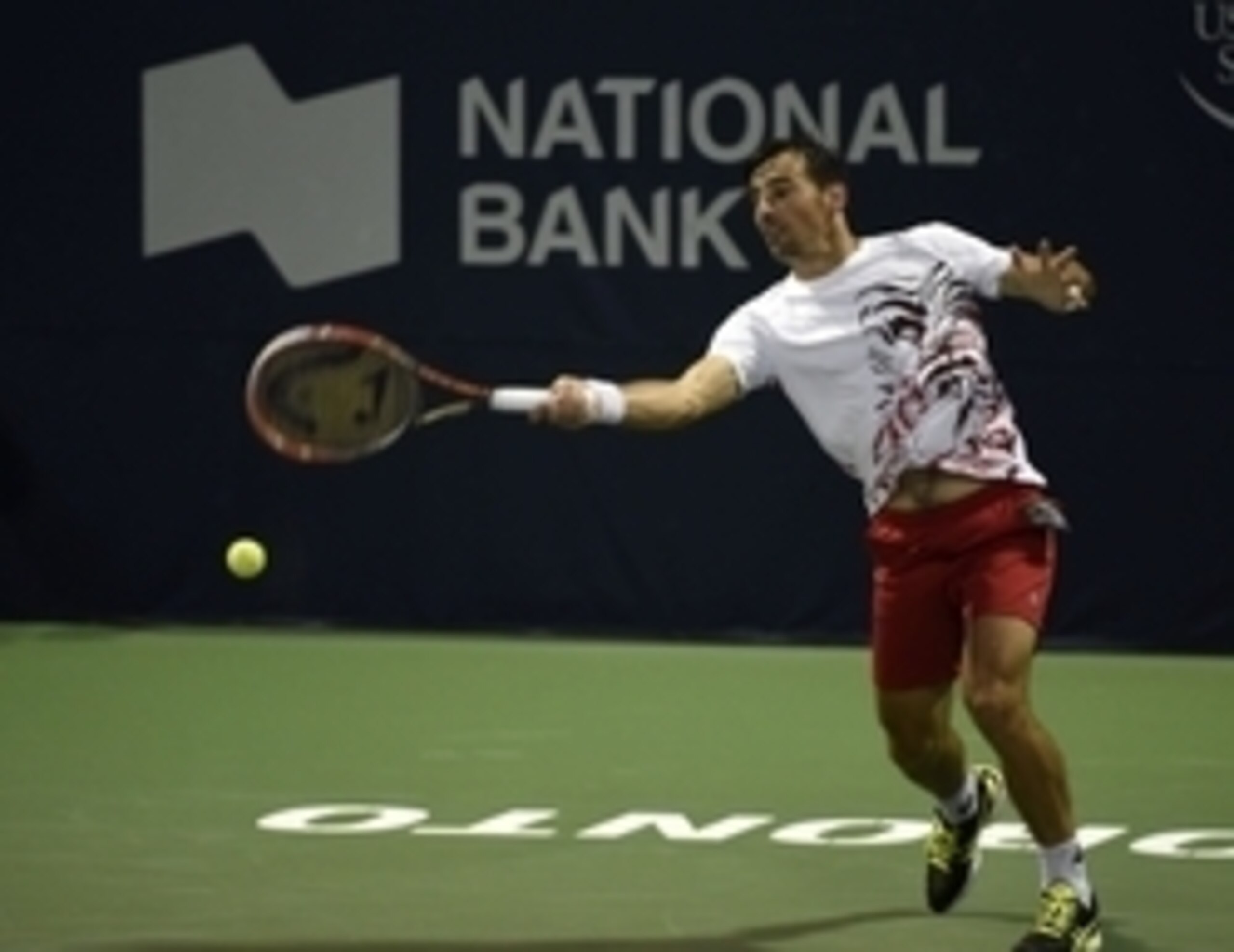 Ivan Dodig hits a forehand at Rogers Cup.