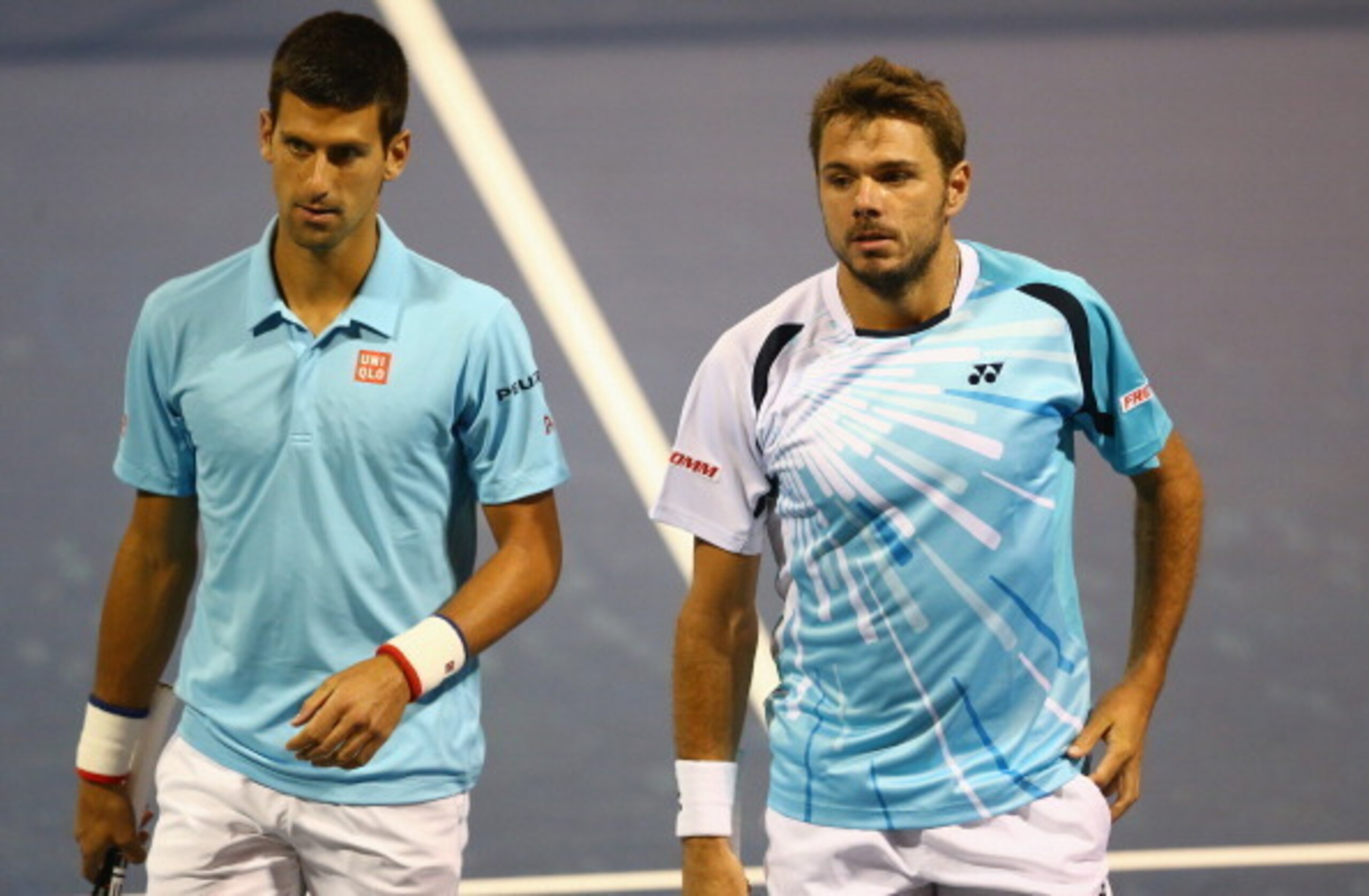 Djokovic, pictured left, playing doubles with Stan Wawrinka