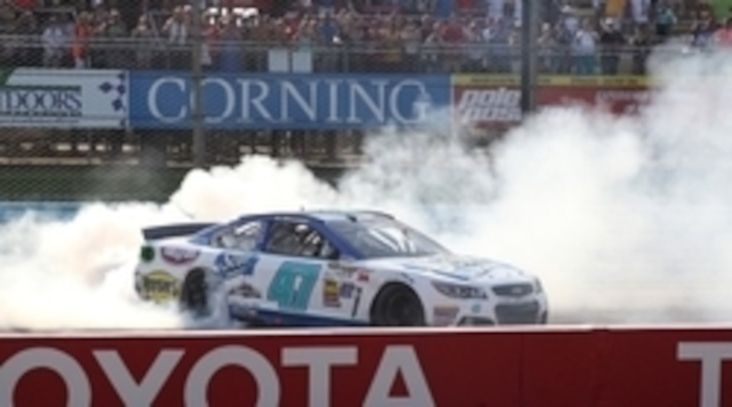 Aug 10, 2014; Watkins Glen, NY, USA; NASCAR Sprint Cup Series driver AJ Allmendinger (47) celebrates a win during the Cheez-It 355 at Watkins Glen International. Mandatory Credit: Timothy T. Ludwig-USA TODAY Sports