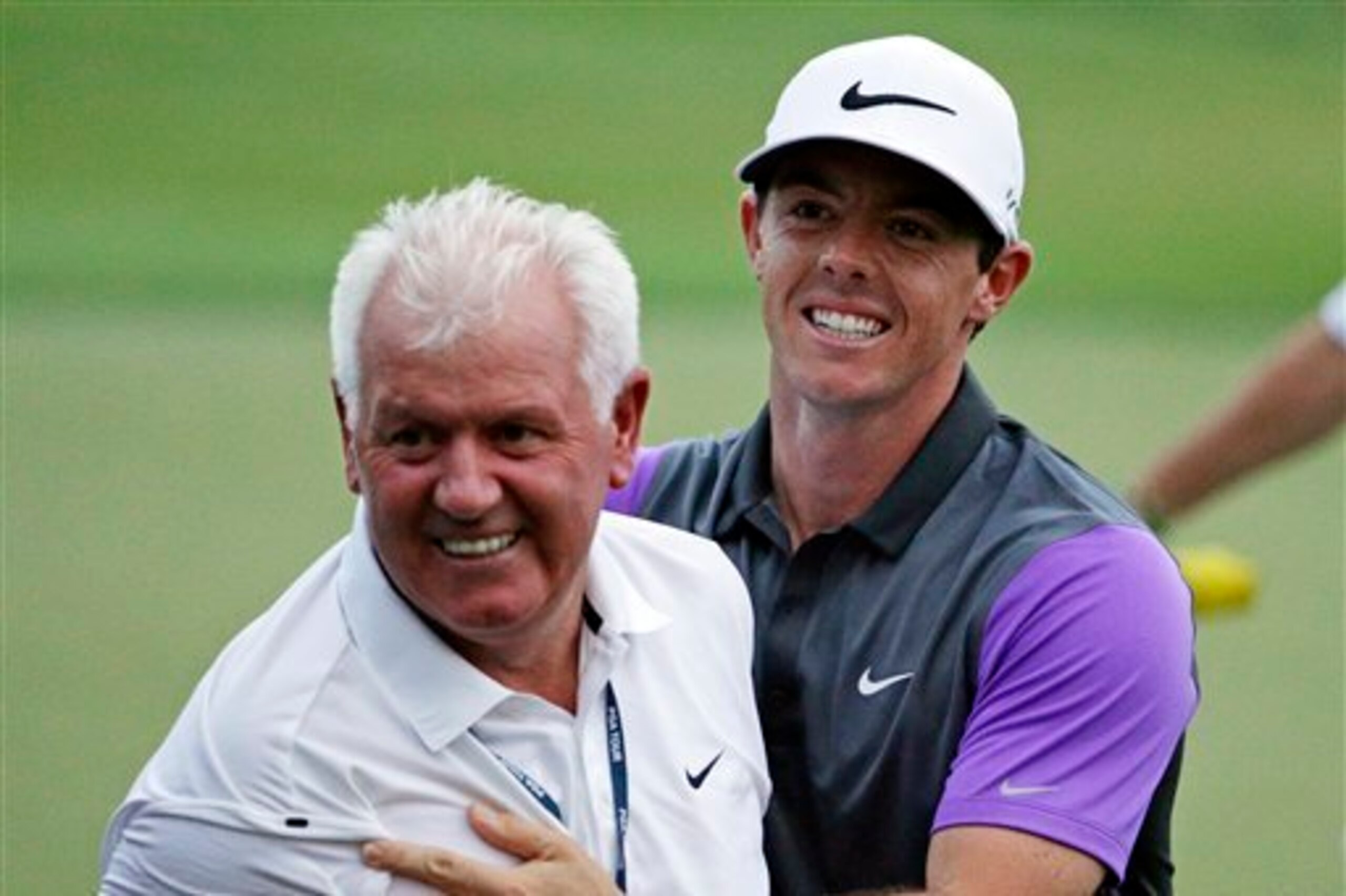 Rory McIlroy and his dad, Gerry, celebrate Sunday night.