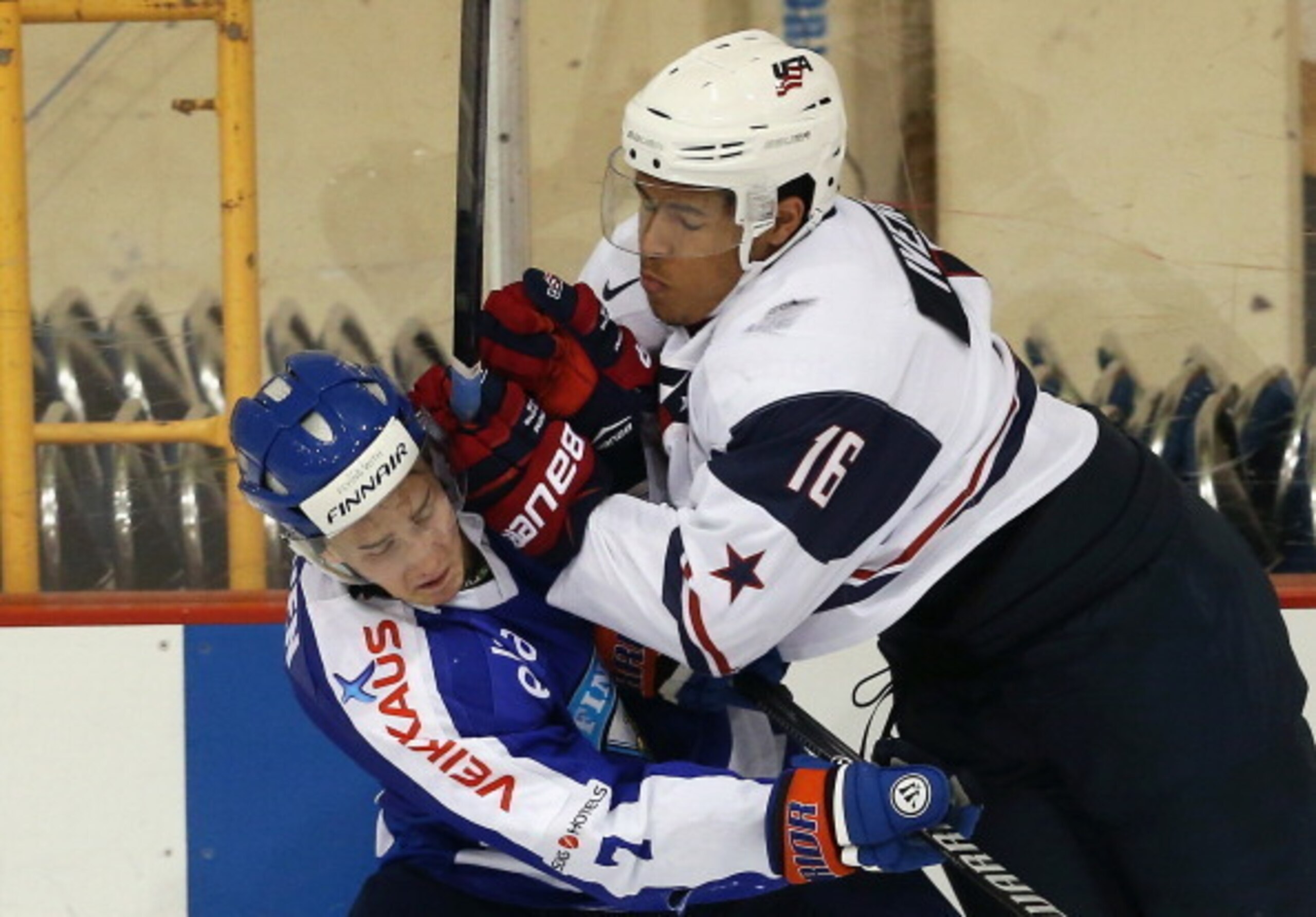 Iverson imposes his will on a Finnish player.