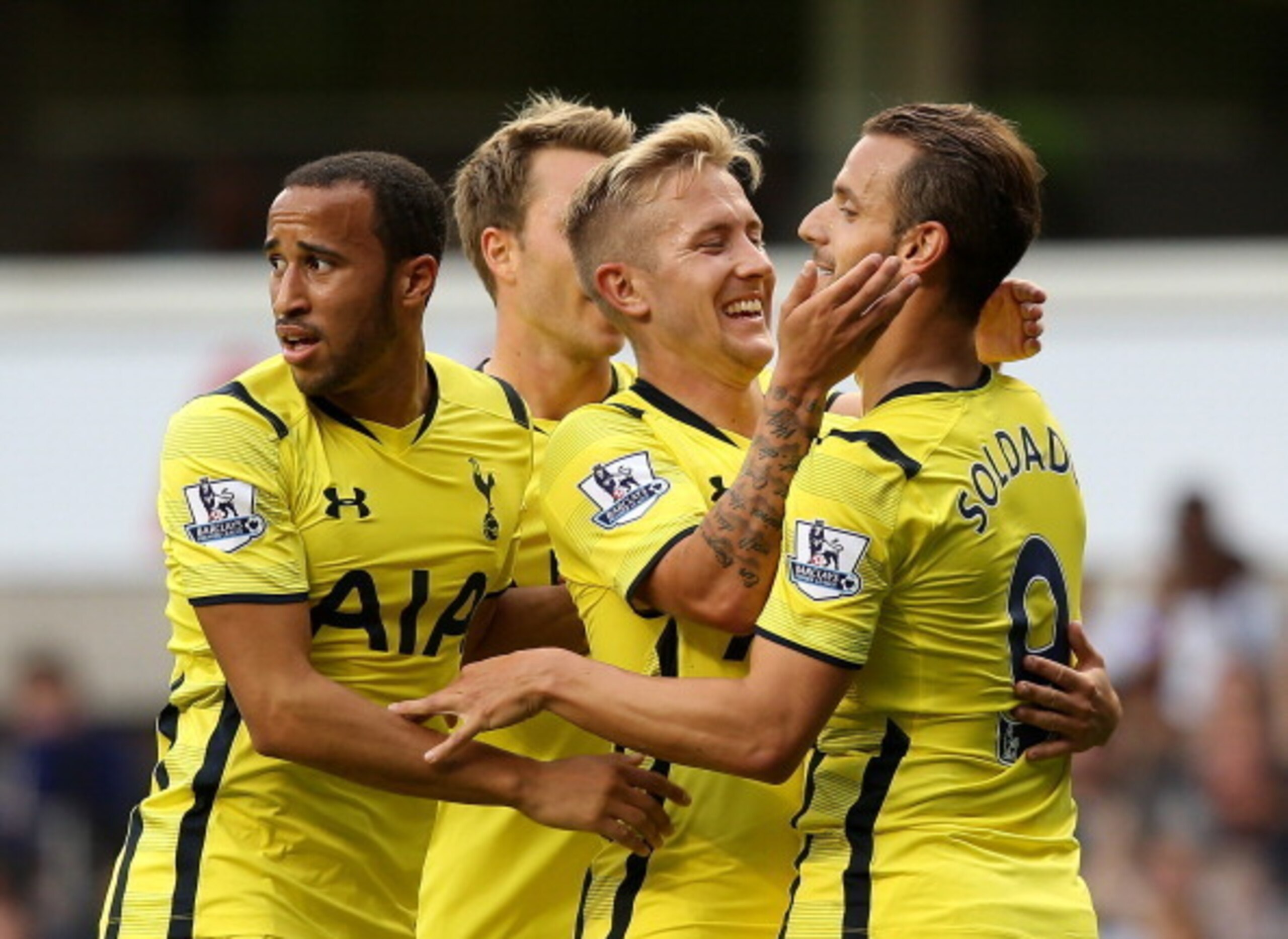 Roberto Soldado's Spurs team-mates congratulate him after the Spaniard scored against Schalke.