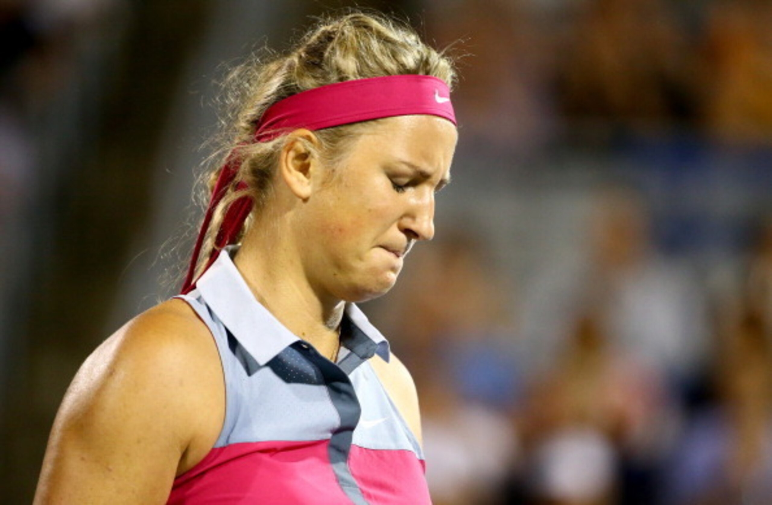 MONTREAL, QC - AUGUST 08:  Victoria Azarenka of Belarus reacts after a shot to Agnieszka Radwanska of Poland in their quarterfinal match during the Rogers Cup at Uniprix Stadium on August 8, 2014 in Montreal, Canada.  (Photo by Streeter Lecka/Getty Images