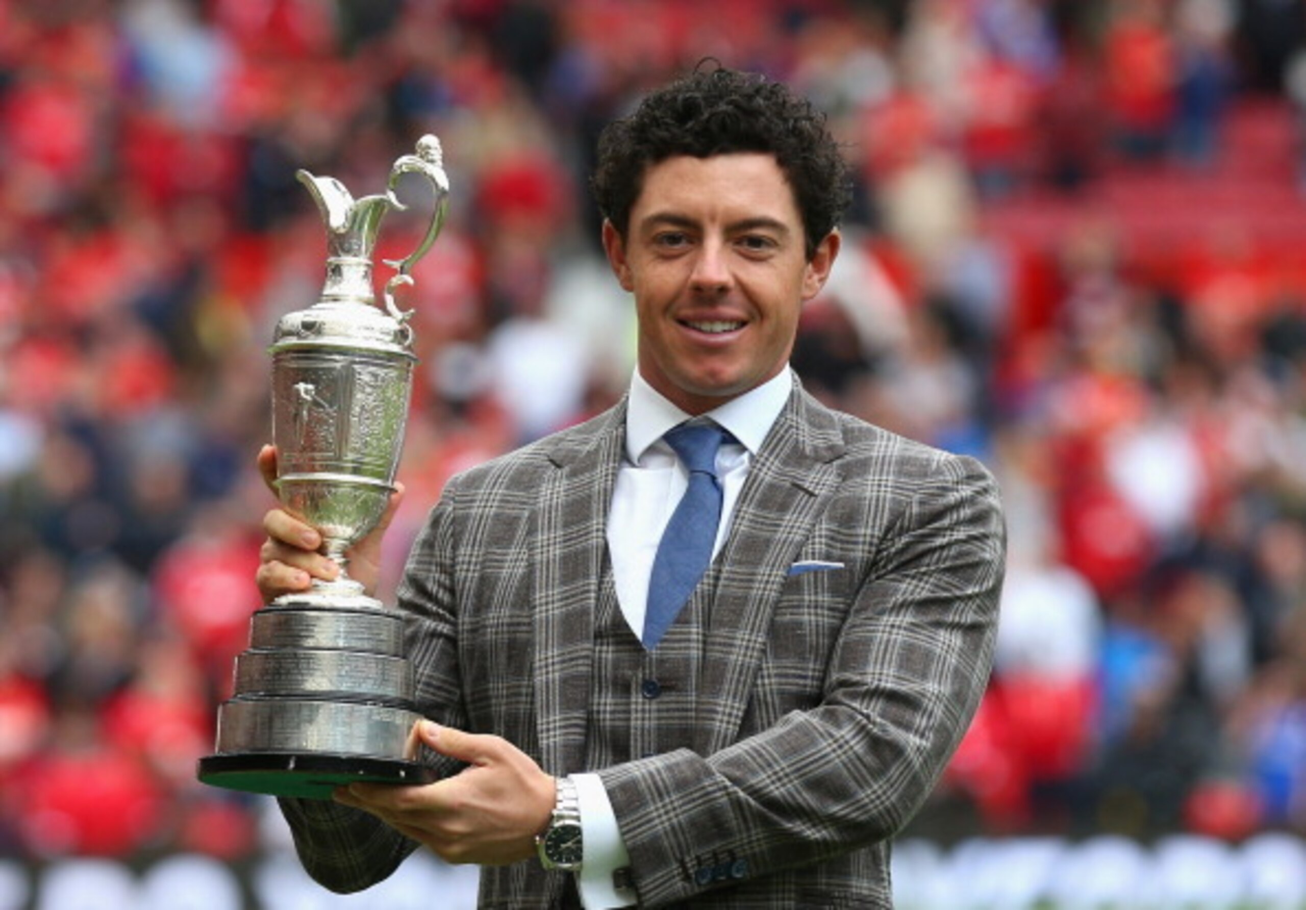 Rory McIlroy shows off the Claret Jug at a recent soccer game.