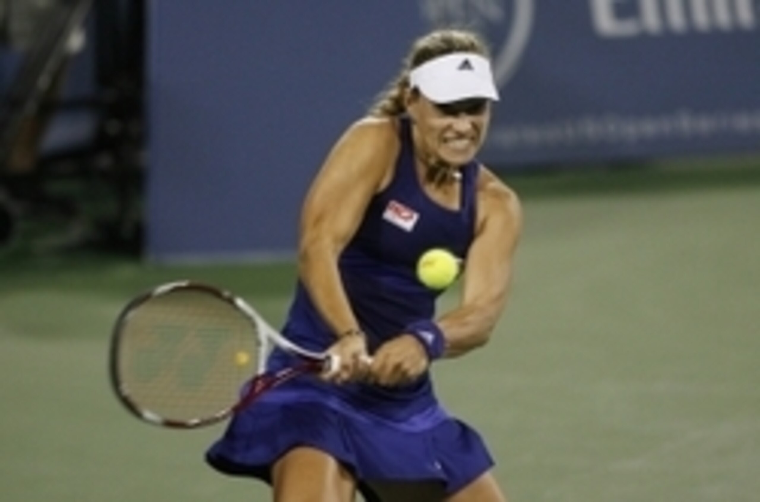 Angelique Kerber hits a backhand during a match against Caroline Wozniacki in Cincinnati.