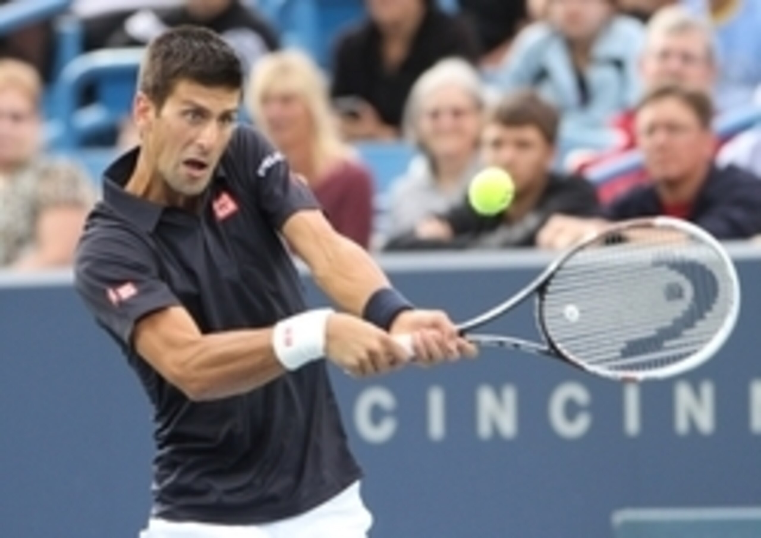 Novak Djokovic blasts a backhand during a match at the 2014 Western & Southern Open.