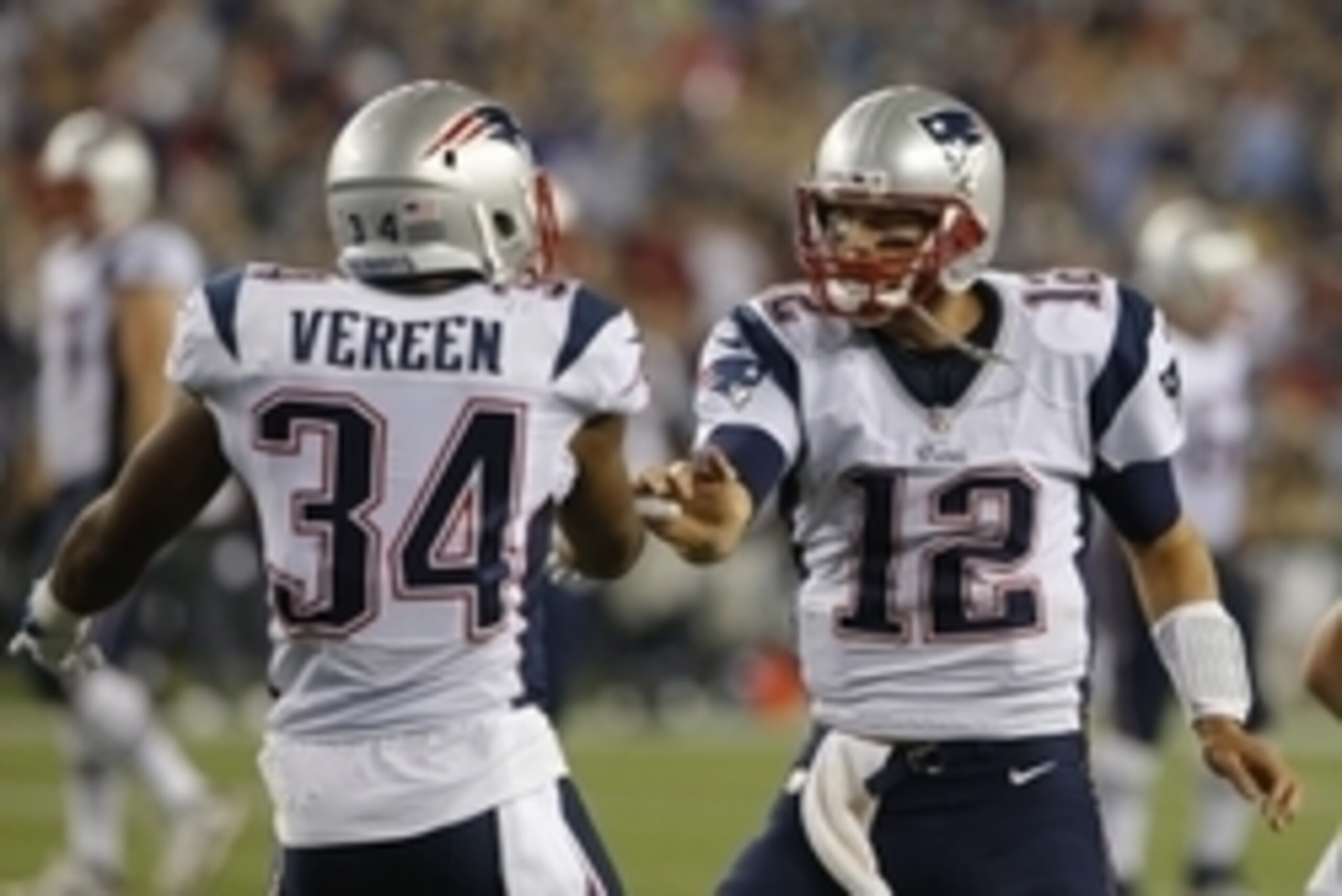 Aug 22, 2014; Foxborough, MA, USA; New England Patriots quarterback Tom Brady (12) congratulates running back Shane Vereen (34) after his touchdown run against the Carolina Panthers in the first half at Gillette Stadium. Mandatory Credit: David Butler II-