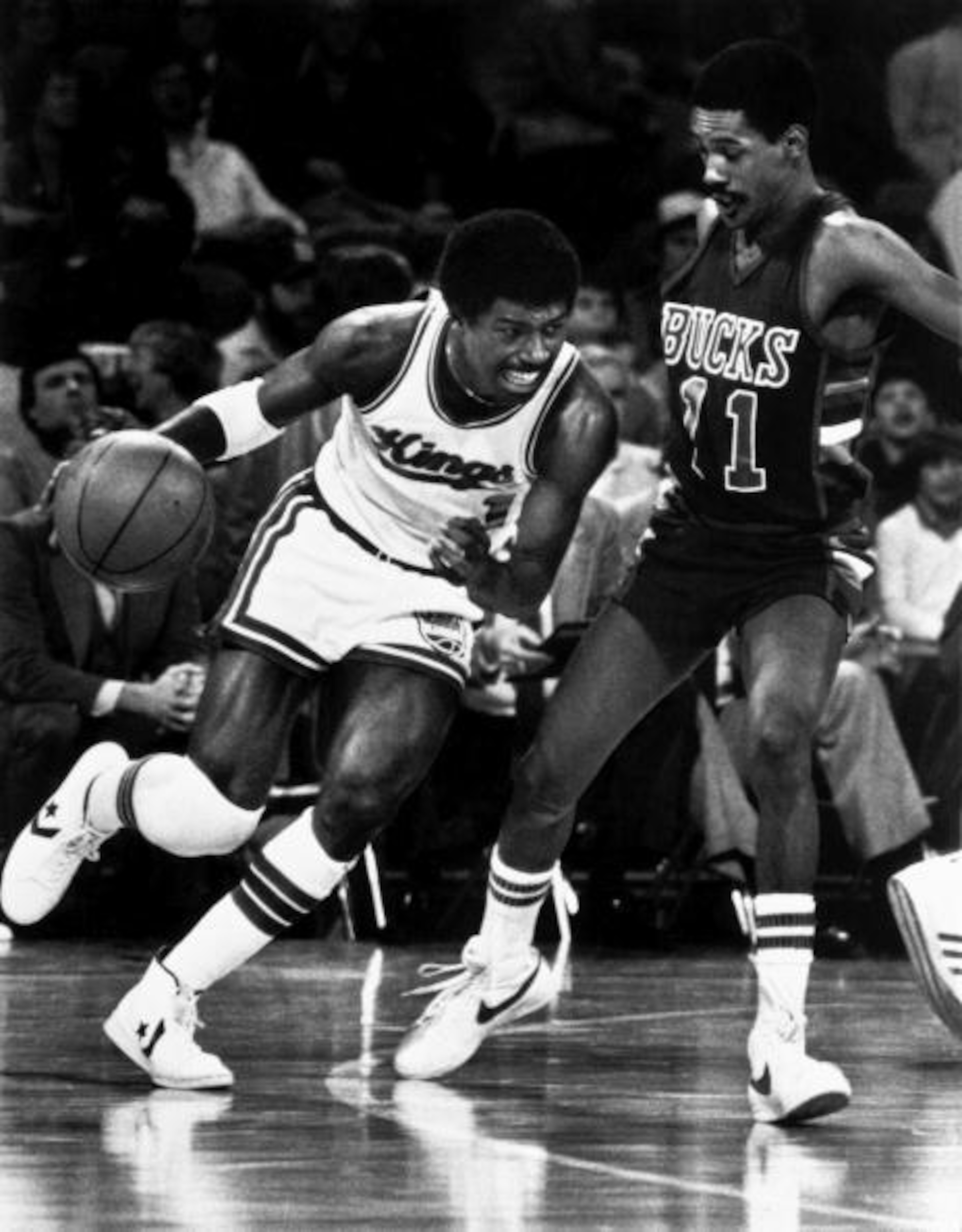 Ford driving on Milwaukee Bucks guard Lloyd Walton in 1978-79.