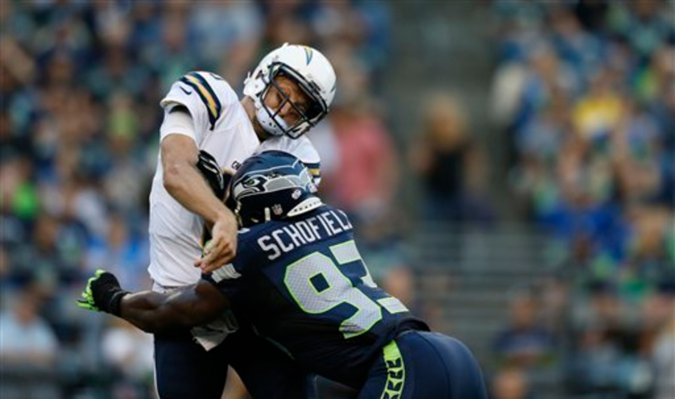 O'Brien Schofield hits San Diego Chargers quarterback Kellen Clemens during Week 2 of preseason.