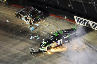 Denny Hamlin wrecks early during the Irwin Tools Night Race