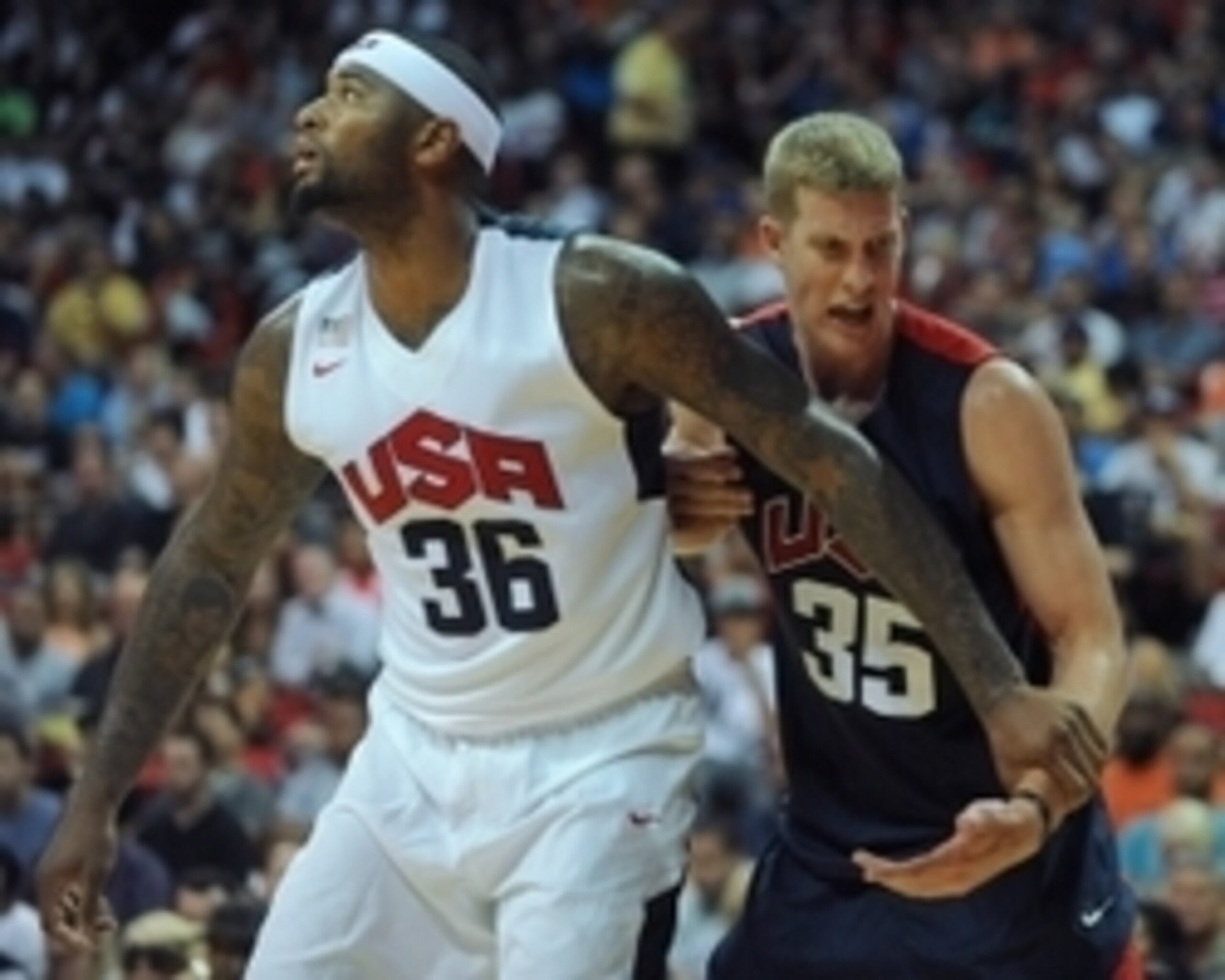 Aug 1, 2014; Las Vegas, NV, USA; USA Team Blue forward Mason Plumlee (35) reacts to his wrist being held by USA Team White center DeMarcus Cousins (36) during the USA Basketball Showcase at Thomas & Mack Center. Mandatory Credit: Stephen R. Sylvanie-USA T