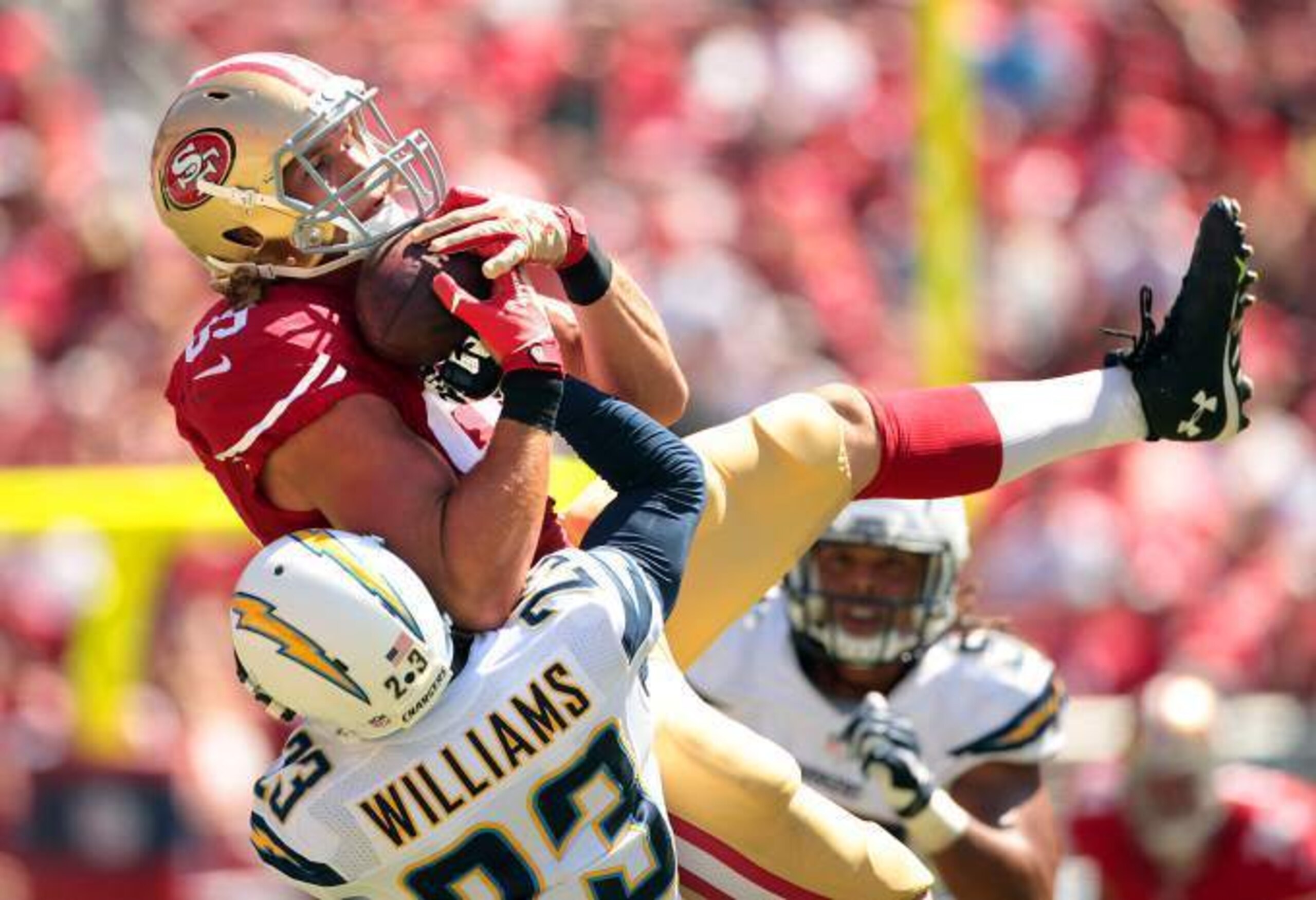 Steve Williams attempts to take down tight end Vance McDonald.