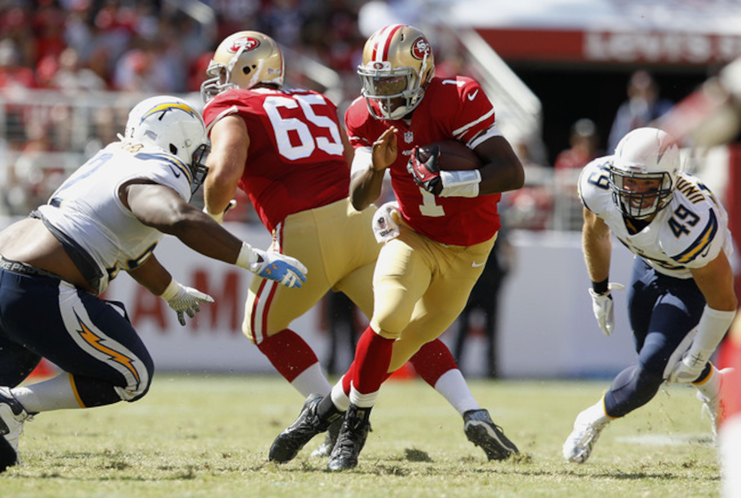 Ryan Carrethers prepares to take down 49ers quarterback Josh Johnson.