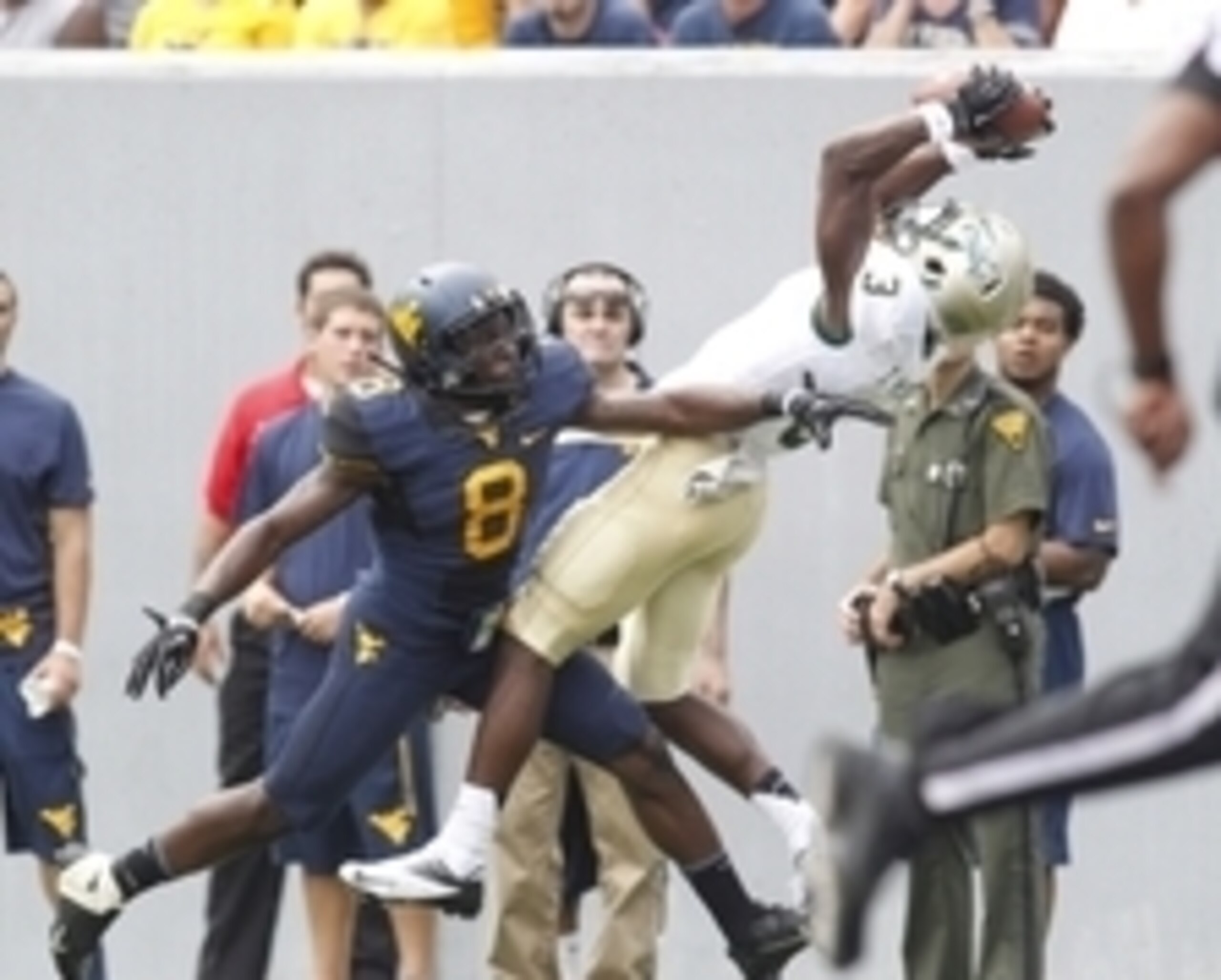 Aug 31, 2013; Morgantown, WV, USA; William & Mary Tribe wide receiver Tre McBride (3) makes a pass reception behind West Virginia Mountaineers safety Karl Joseph (8) during the second quarter at Milan Puskar Stadium. Mandatory Credit: Charles LeClaire-USA