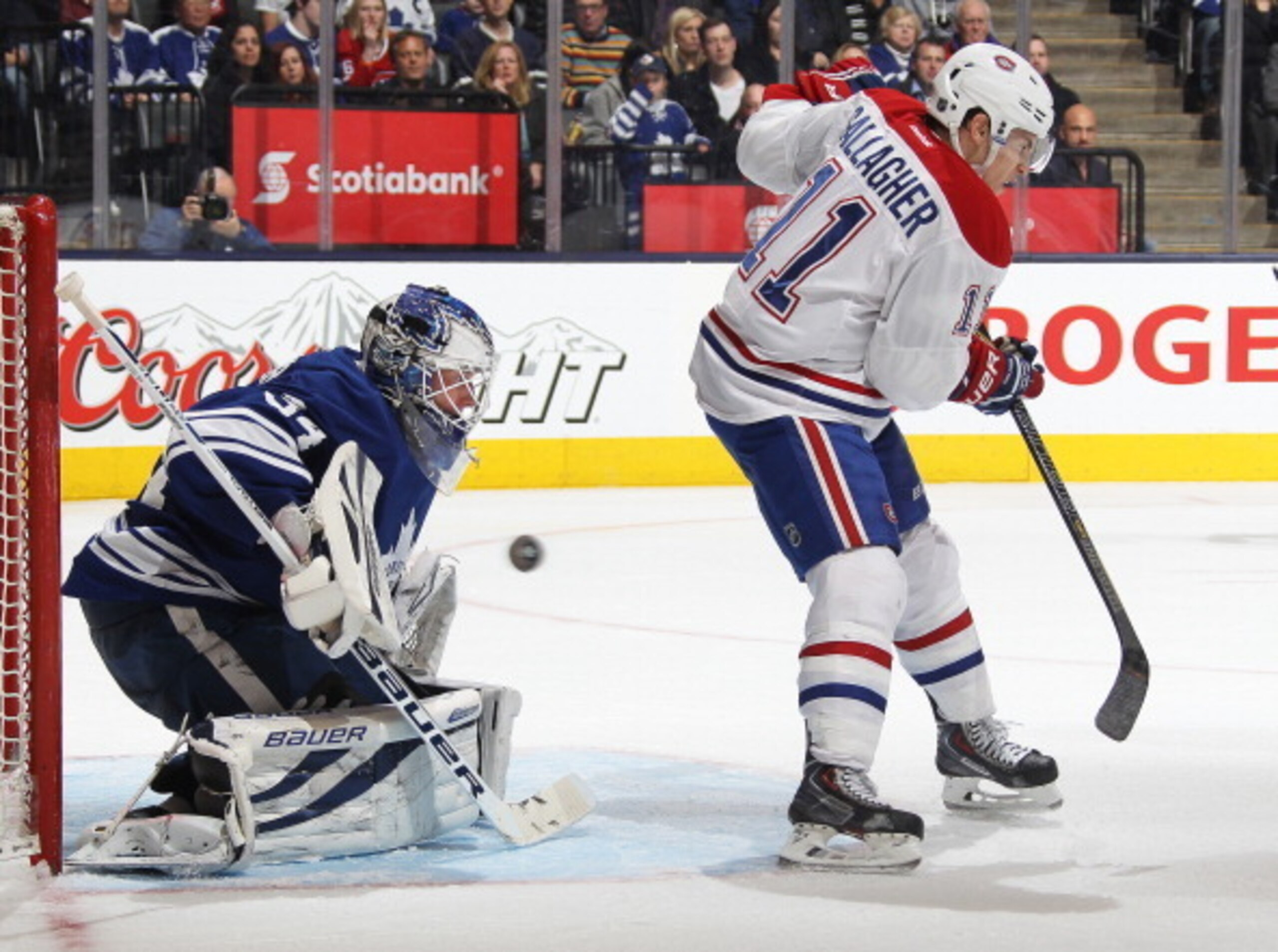 TORONTO, ON - MARCH 22:  Brendan Gallagher #11 of the Montreal Canadiens tips a shot at James Reimer #34 of the Toronto Maple Leafs during an NHL game at the Air Canada Centre on March 22, 2014 in Toronto, Ontario, Canada. The Canadiens defeated the Leafs
