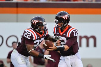 Virginia Tech quarterback Michael Brewer handing off to Shai McKenzie in last Saturday's win over William & Mary