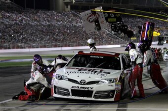 HAMPTON, GA - AUGUST 31:  Denny Hamlin, driver of the #11 Sport Clips Toyota, pits during the NASCAR Sprint Cup Series Oral-B USA 500 at Atlanta Motor Speedway on August 31, 2014 in Hampton, Georgia.  (Photo by Jerry Markland/Getty Images)