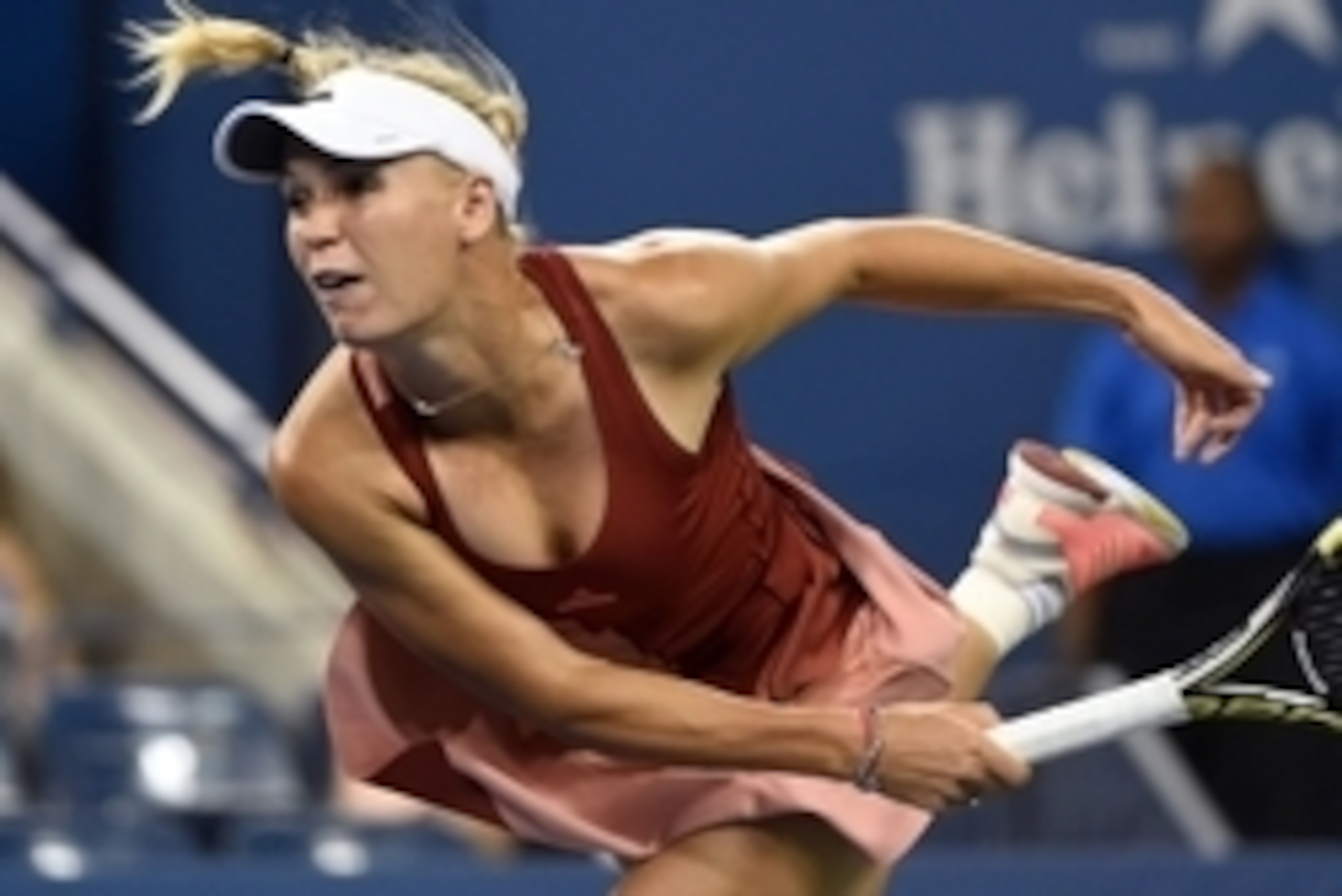 Caroline Wozniacki follows through on a serve during her quarterfinal match at the 2014 U.S. Open. Caroline Wozniacki follows through on a serve during her quarterfinal match at the 2014 U.S. Open.