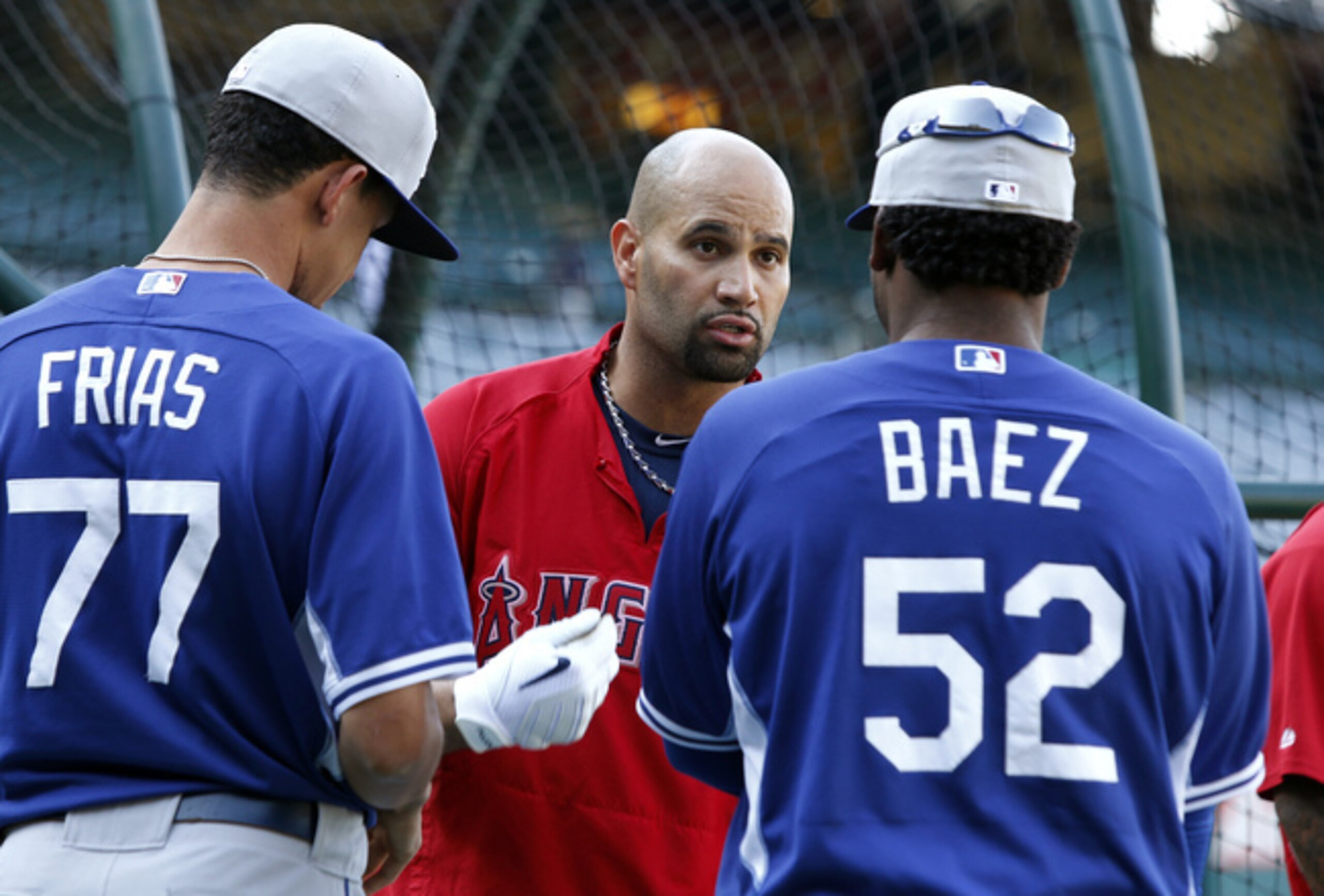 Frias, with Albert Pujols and Pedro Baez
