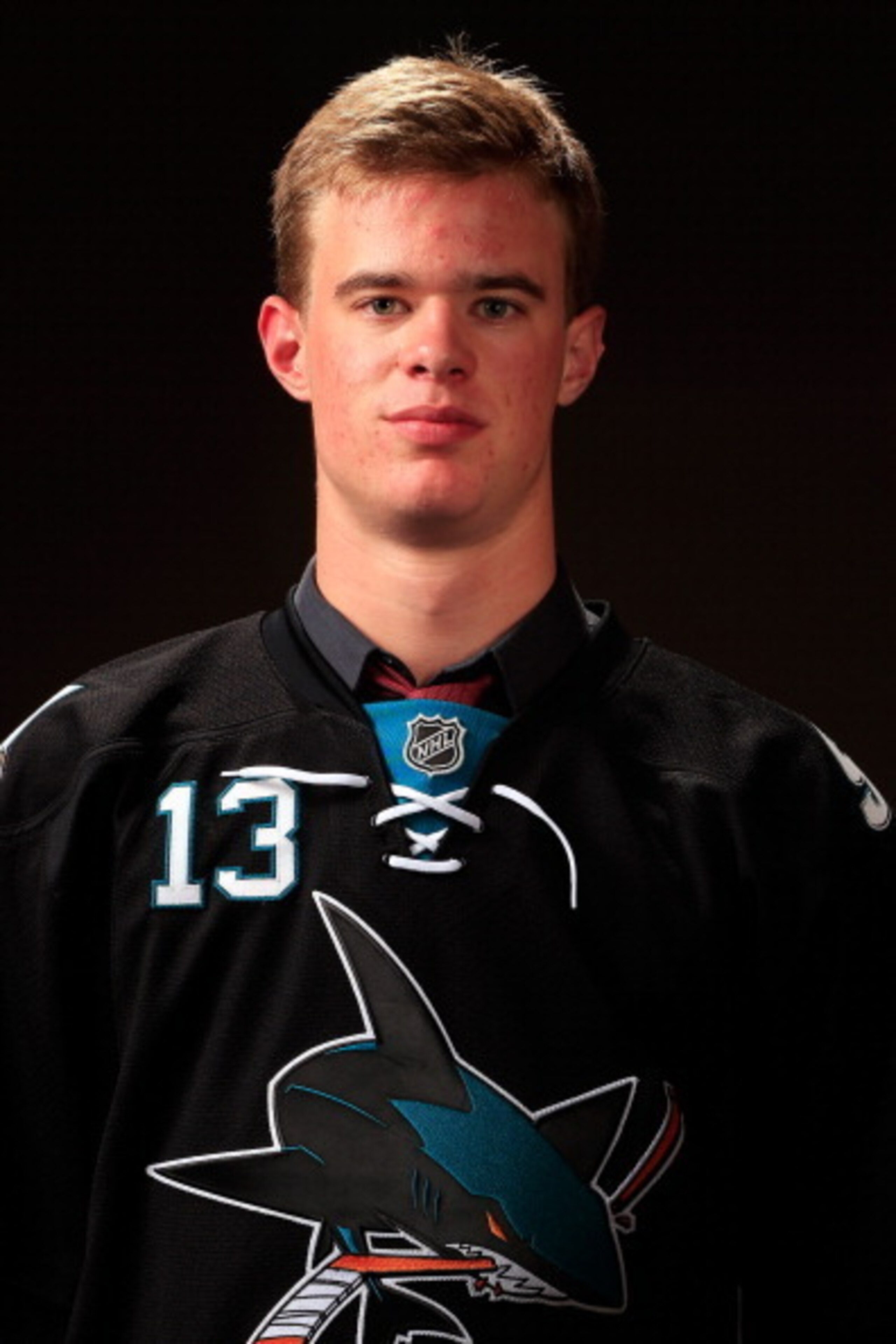 NEWARK, NJ - JUNE 30:  Mirco Mueller, 18th overall pick by the San Jose Sharks, poses for a portrait during the 2013 NHL Draft at the Prudential Center on June 30, 2013 in Newark, New Jersey.  (Photo by Jamie Squire/Getty Images)