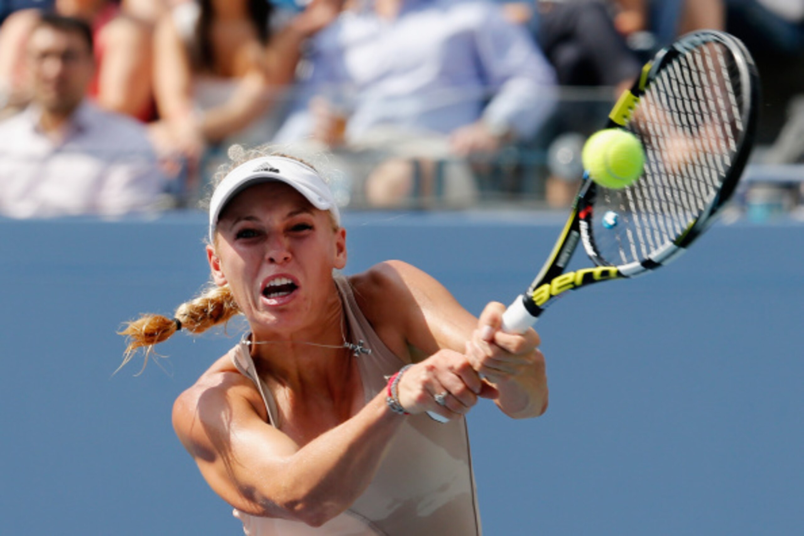 Wozniacki hits a backhand during her semifinal match at the 2014 U.S. Open.
