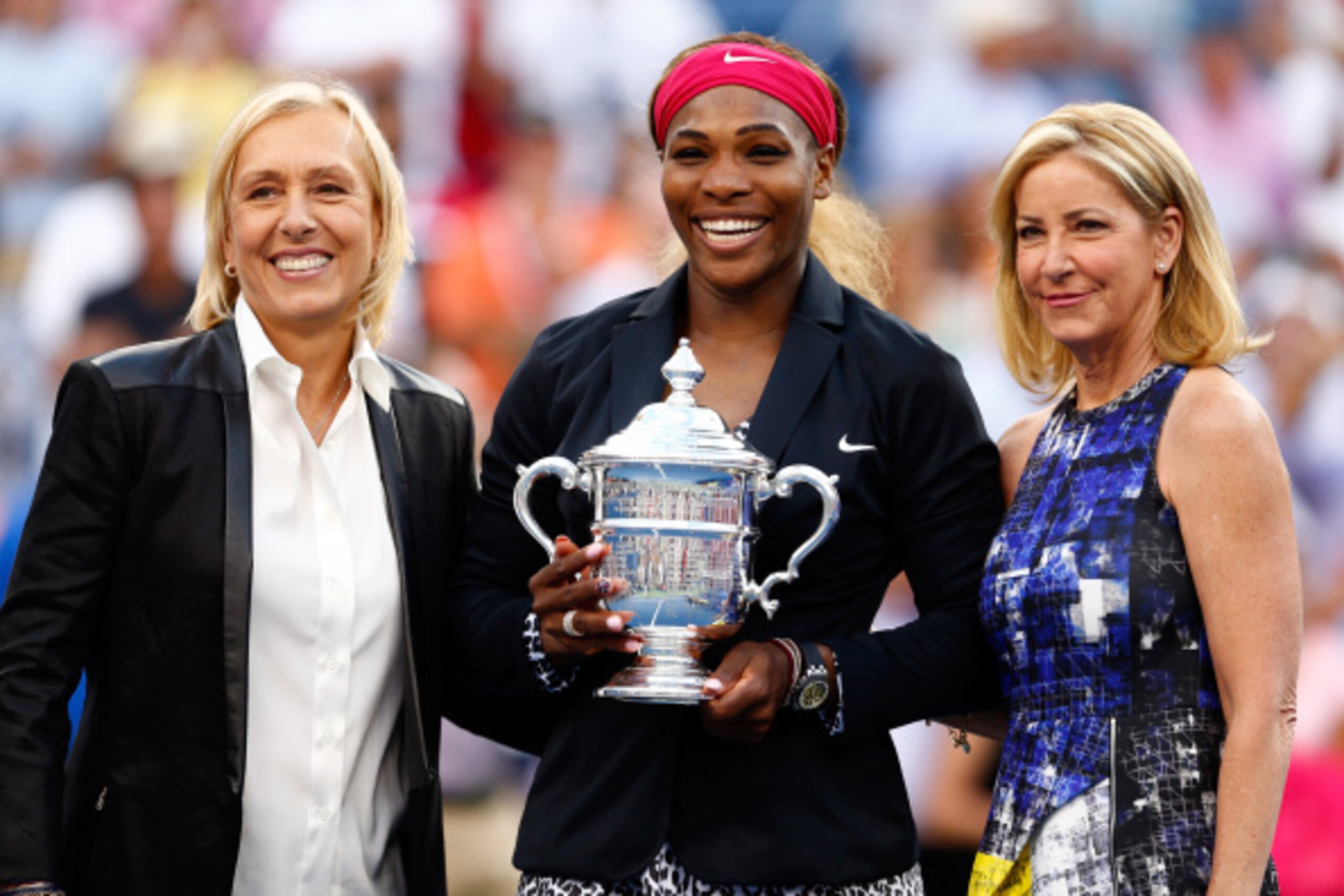 Martina Navratilova and Chris Evert flank Serena Williams, who joins the two as the only Americans with 18 Grand Slam titles.