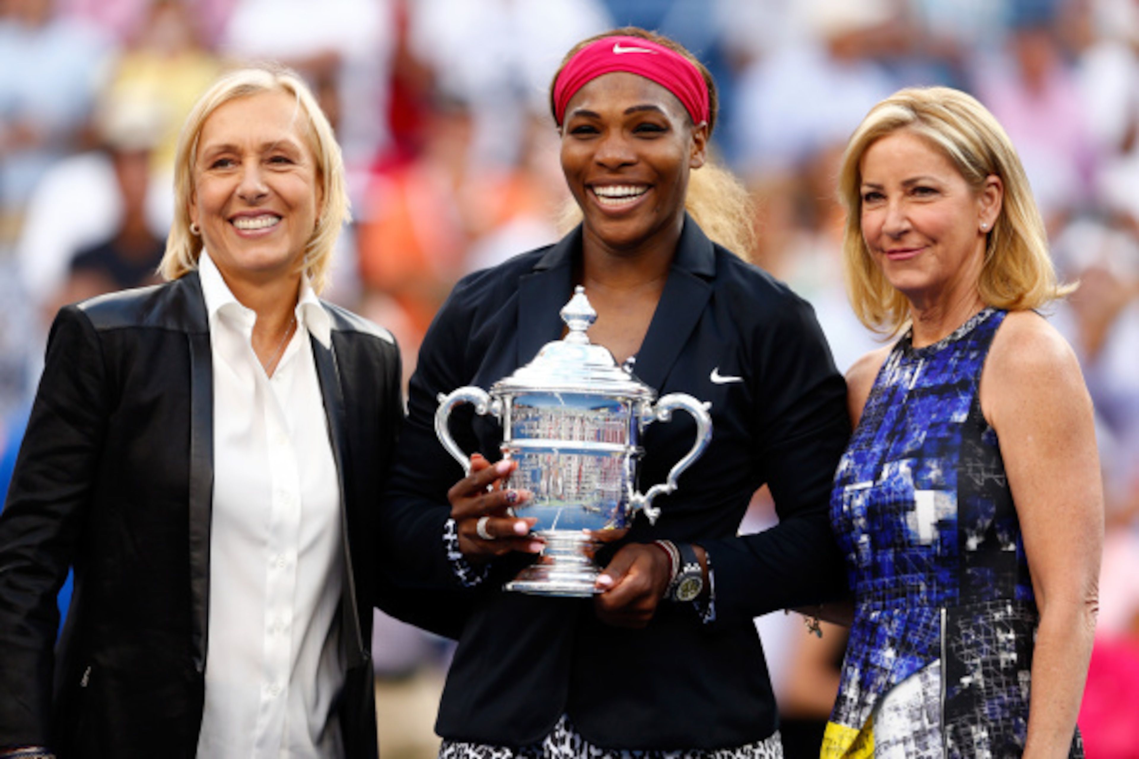 Martina Navratilova and Chris Evert flank Serena Williams, who joins the two as the only Americans with 18 Grand Slam titles.