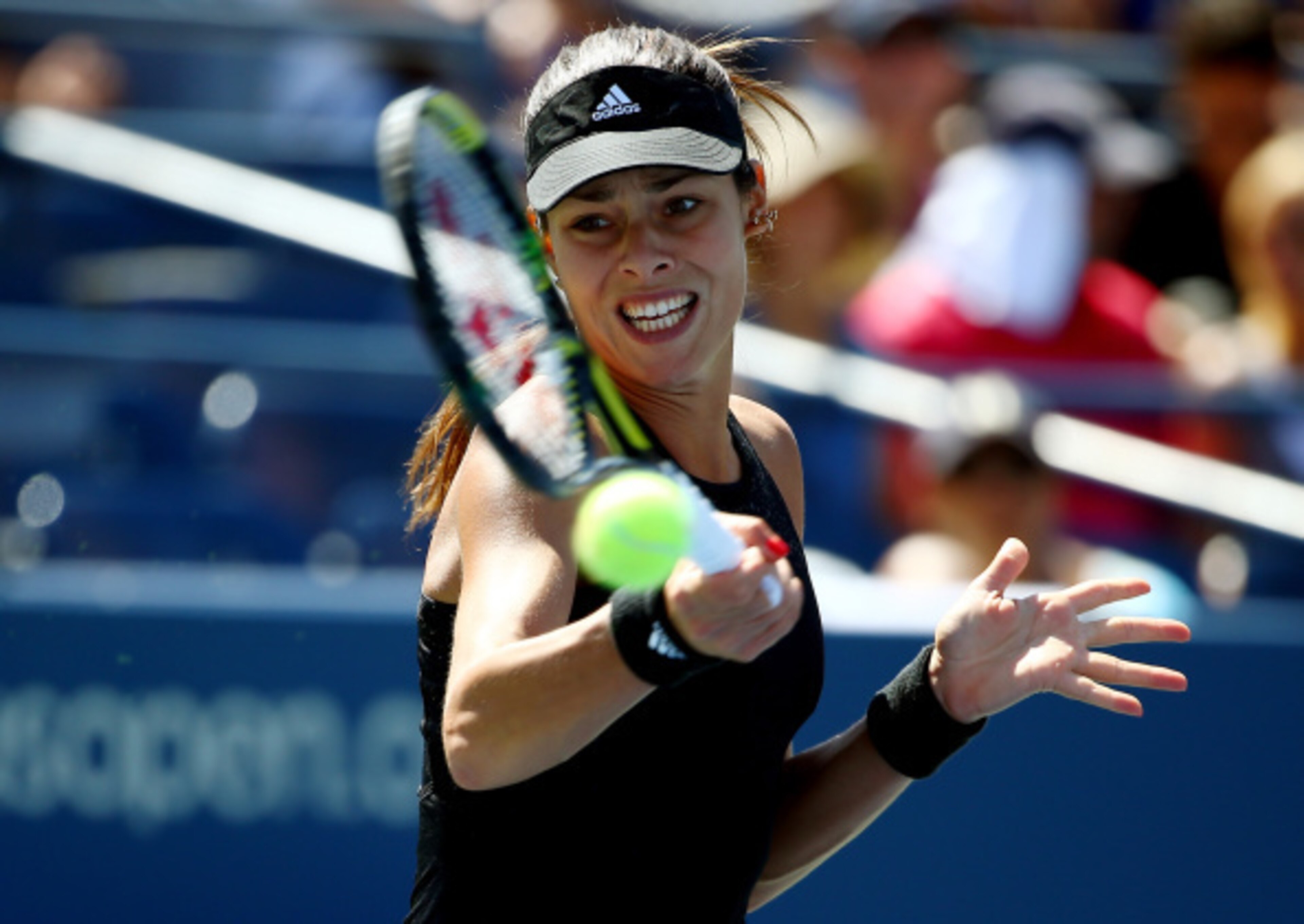 Ana Ivanovic strikes a forehand during an early-round loss at the 2014 U.S. Open.
