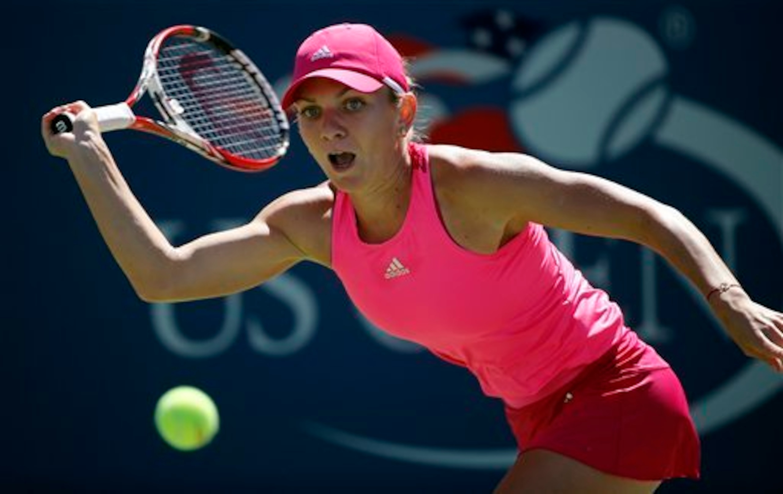 Simona Halep tries to make a play on the ball during a match at 2014 U.S. Open.