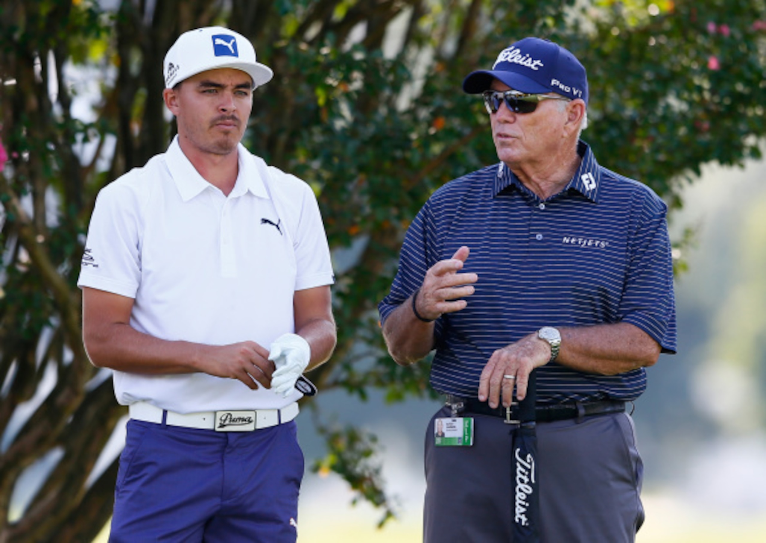 Rickie Fowler gets some encouragement from his coach, Butch Harmon.