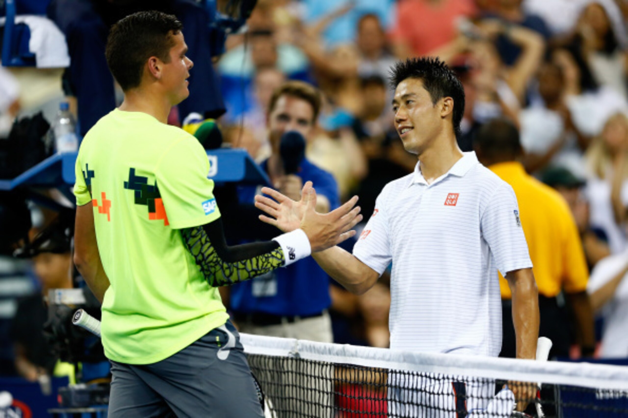 Milos Raonic and Kei Nishikori shake hands after U.S. Open match.