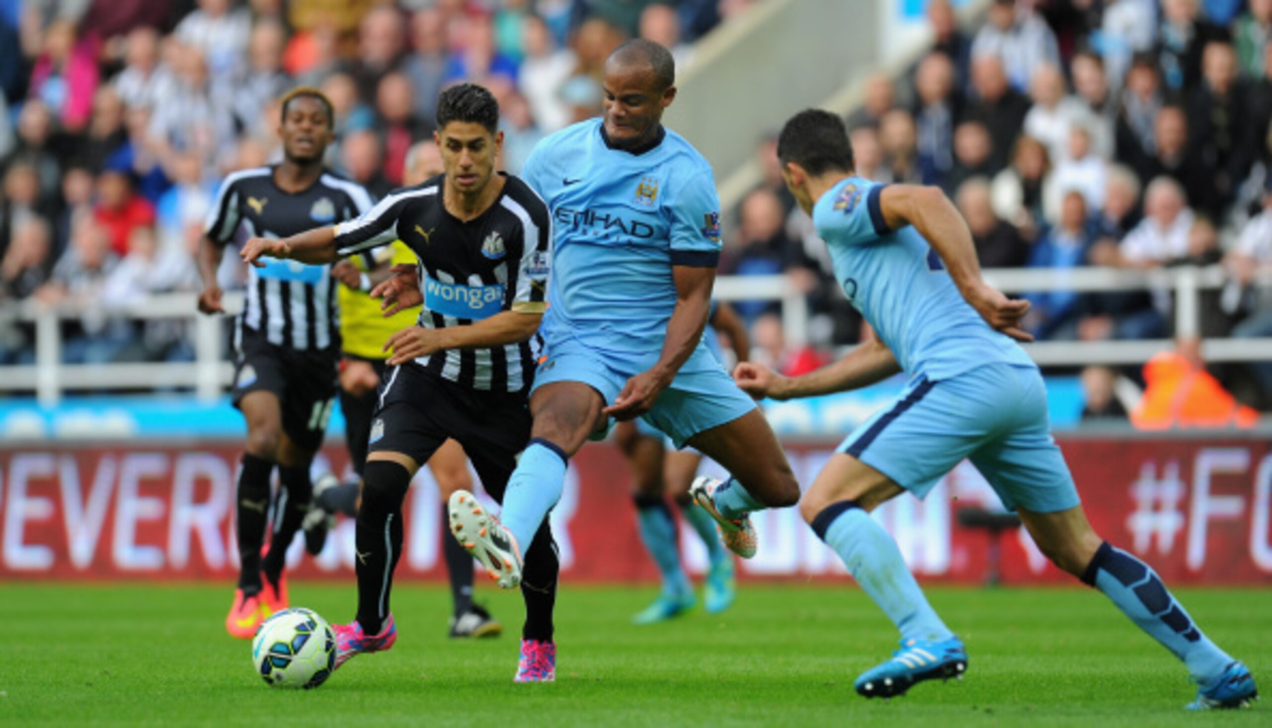 Kompany (center) is the fulcrum of the City back line.