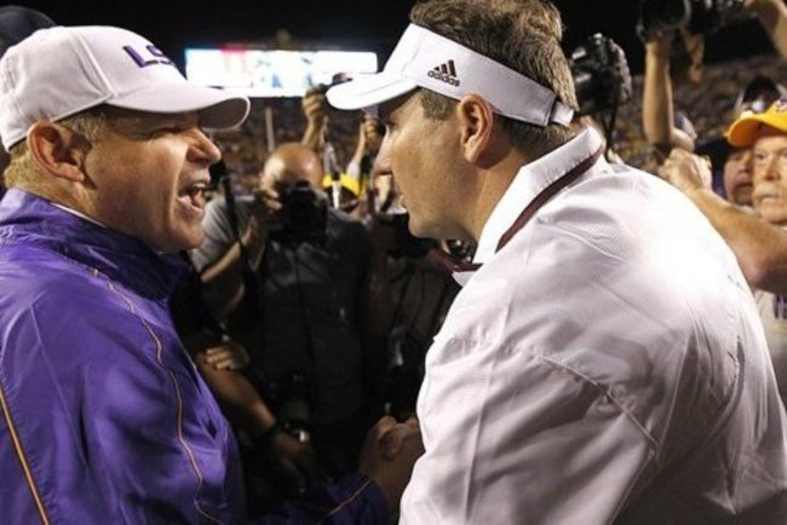 LSU head coach Les Miles (left) and Mississippi State head coach Dan Mullen (right). LSU head coach Les Miles (left) and Mississippi State head coach Dan Mullen (right).