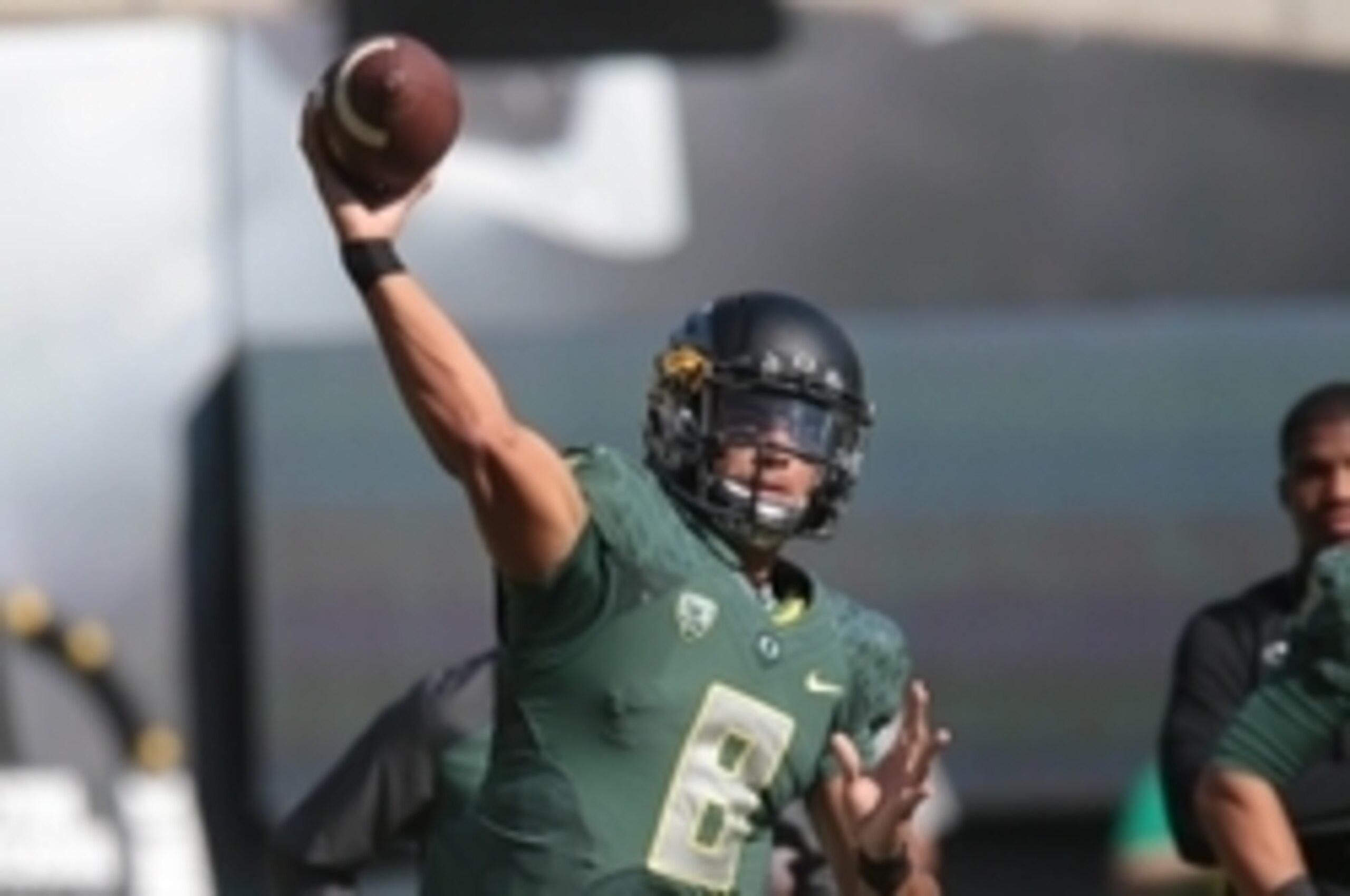 Sep 13, 2014; Eugene, OR, USA; Oregon Ducks quarterback Marcus Mariota (8) throws the ball before the game against the Wyoming Cowboys at Autzen Stadium. Mandatory Credit: Scott Olmos-USA TODAY Sports