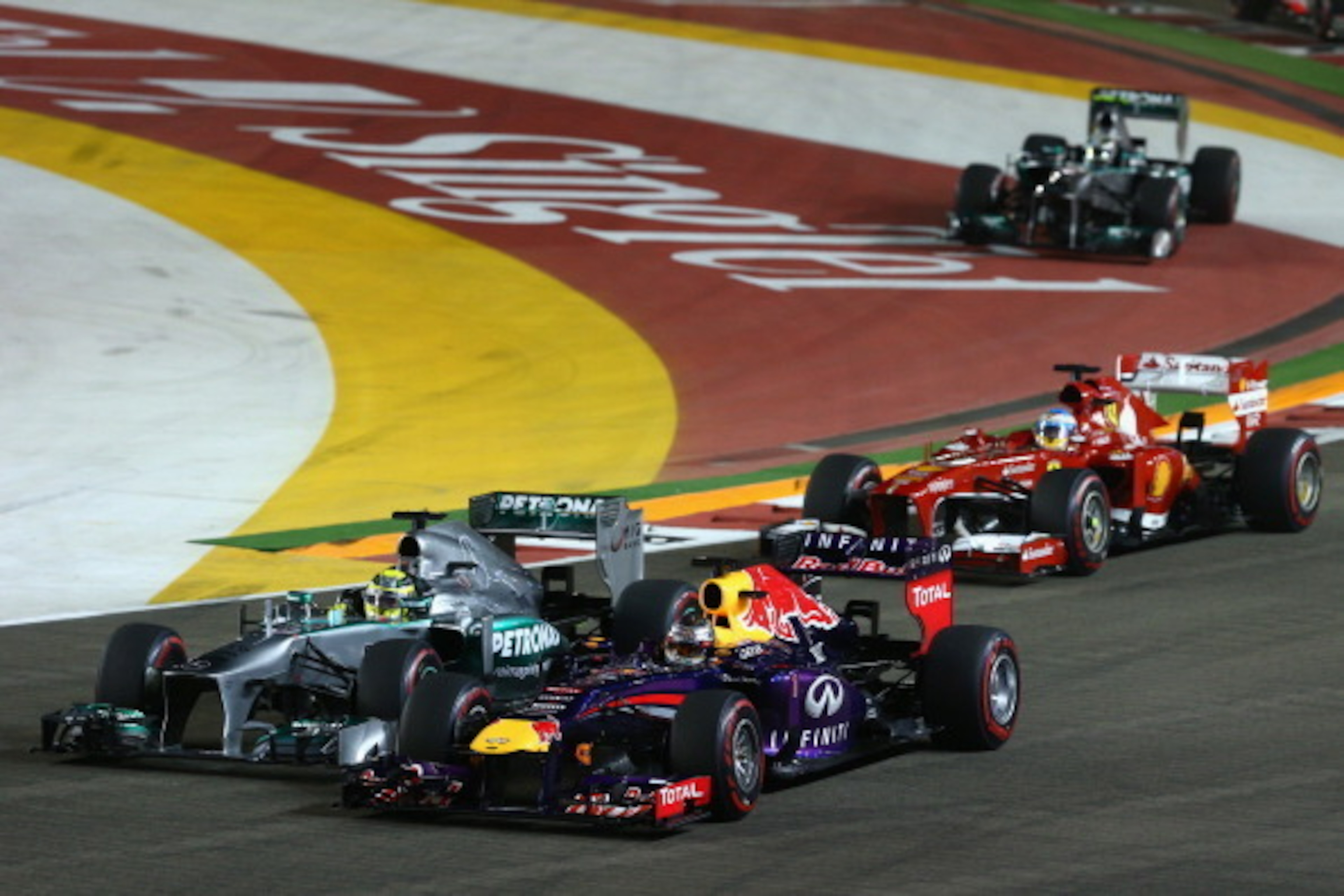 Lewis Hamilton and Sebastian Vettel battle at the start of the 2013 race. Lewis Hamilton and Sebastian Vettel battle at the start of the 2013 race.
