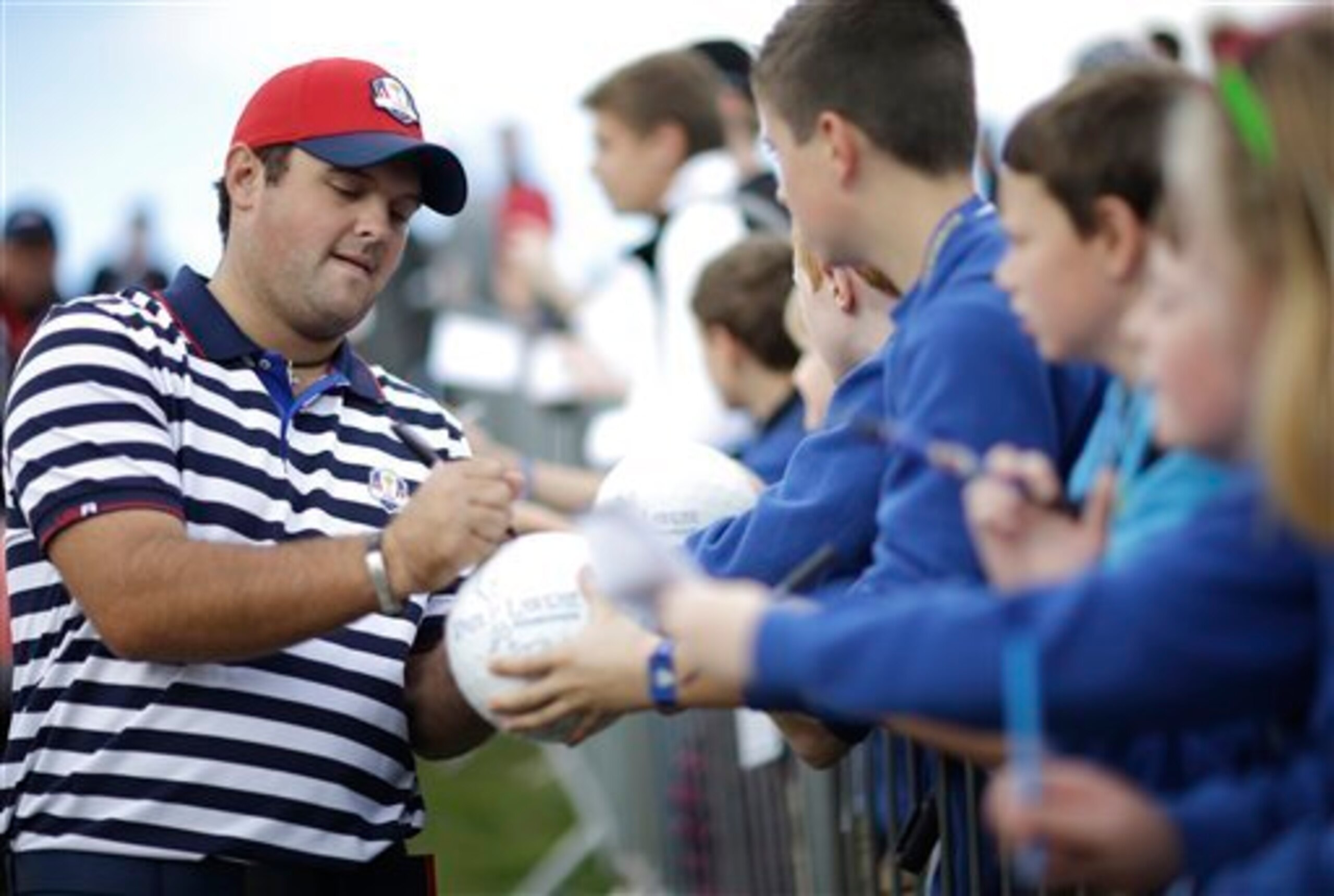 One of team USA's rookies, Patrick Reed, signs autographs at Gleneagles.