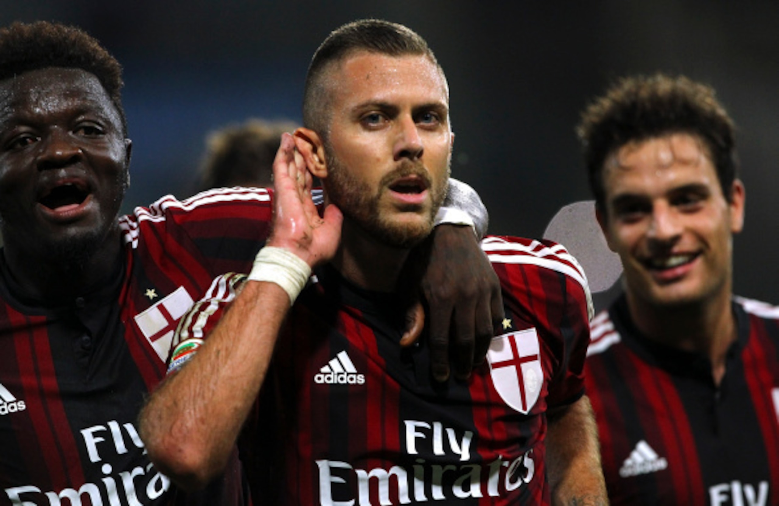 PARMA, ITALY - SEPTEMBER 14:  Jeremy Menez (C) of AC Milan celebrates his goal with his team-mate Sulley Ali Muntari (L)during the Serie A match between Parma FC and AC Milan at Stadio Ennio Tardini on September 14, 2014 in Parma, Italy.  (Photo by Marco 