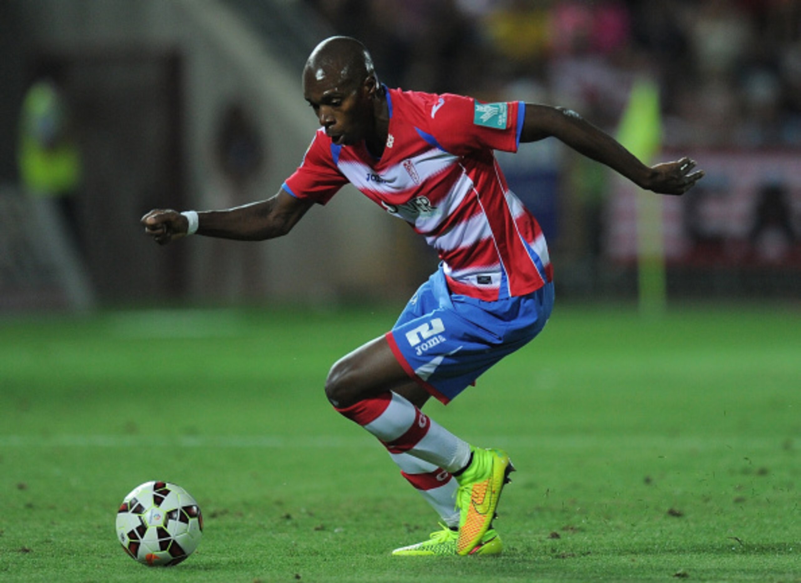 GRANADA, SPAIN - AUGUST 23:  Allan Nyom of Granada FC in action during the La liga match between Granada CF and RC Deportivo La Coruna at Estadio Nuevo Los Carmenes on August 23, 2014 in Granada, Spain.  (Photo by Denis Doyle/Getty Images)