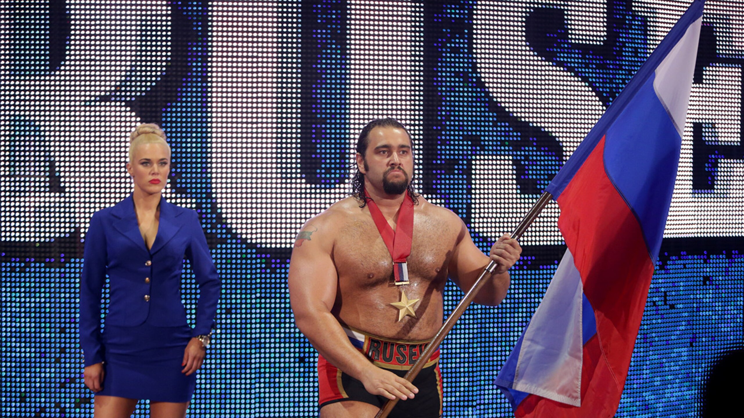 Lana accompanies Rusev to the ring.