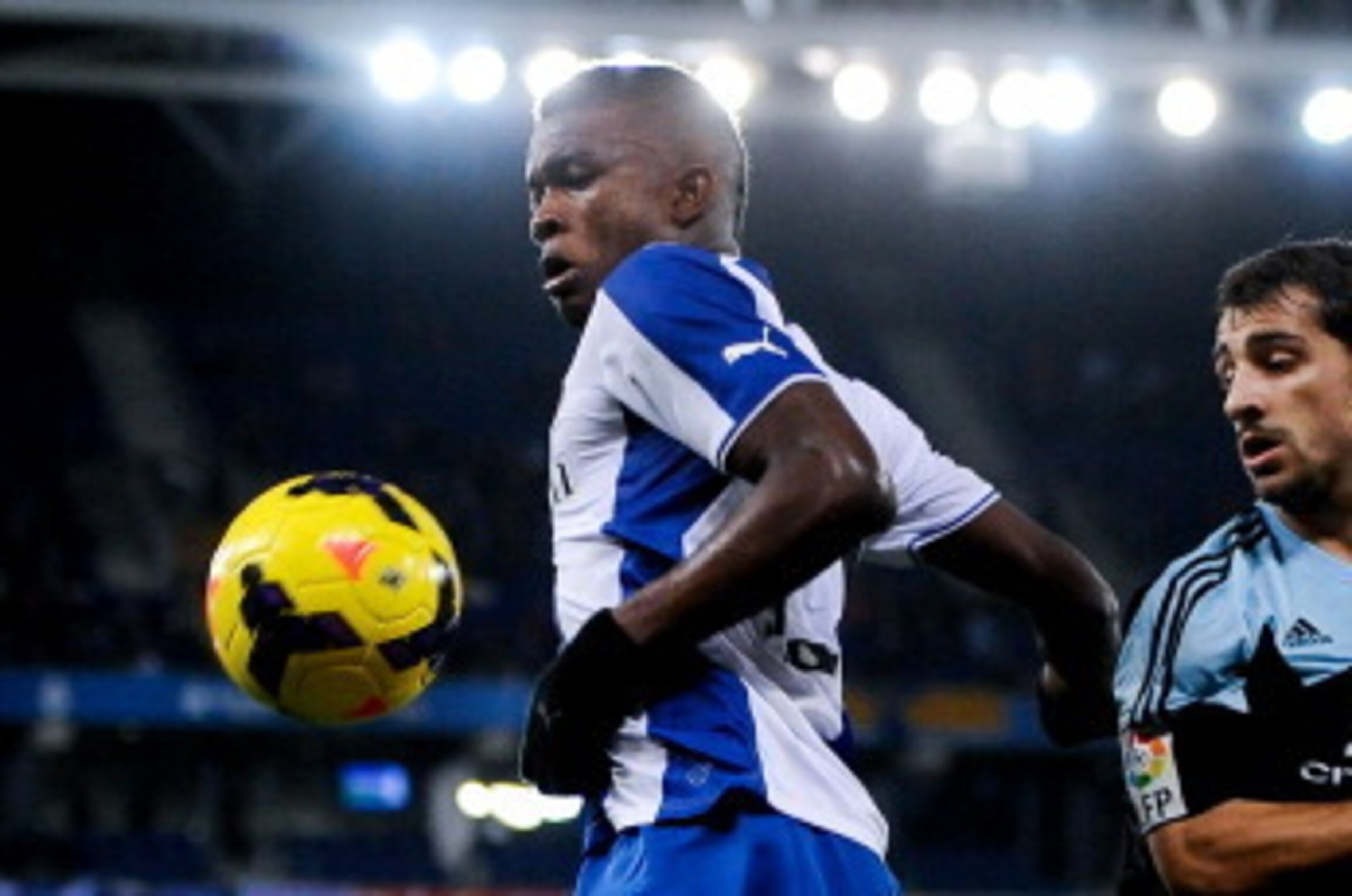 BARCELONA, SPAIN - JANUARY 18:  Jhon Cordoba (L) of RCD Espanyol Jonny Castro of RC Celta de Vigo during the La Liga match between RCD Espanyol and RC Celta de Vigo at Cornella-El Prat Stadium on January 18, 2014 in Barcelona, Spain.  (Photo by David Ramo