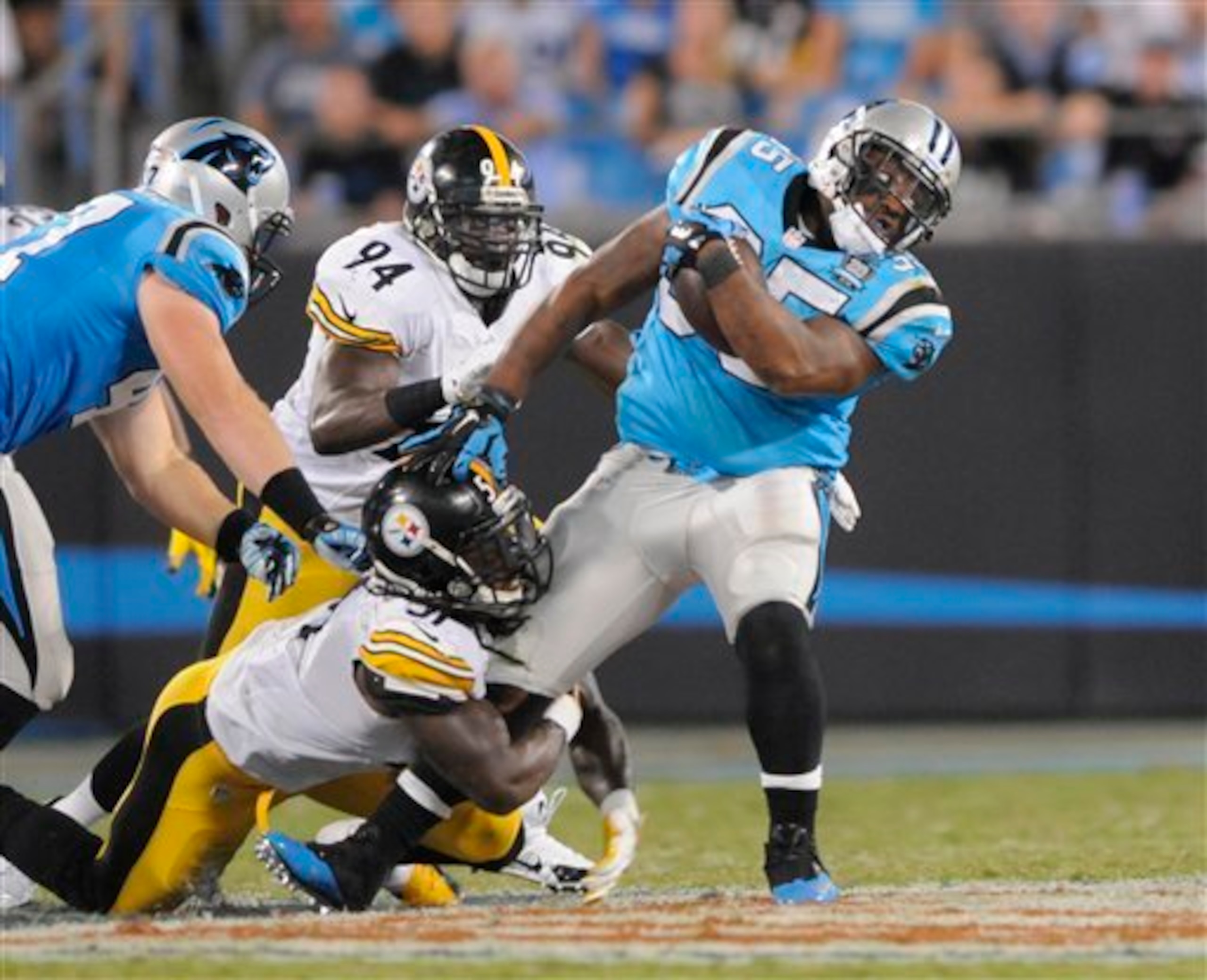 Sean Spence tackles Mike Tolbert during the Steelers' win over the Carolina Panthers.